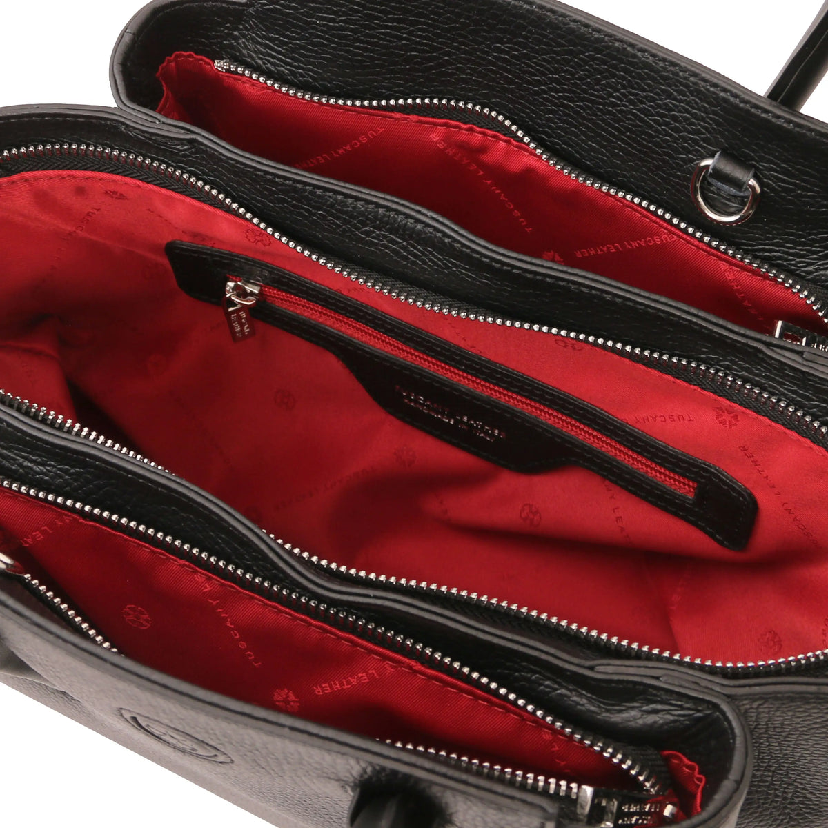 Black leather handbag with a red interior lining, zip pocket and visible brand logo.