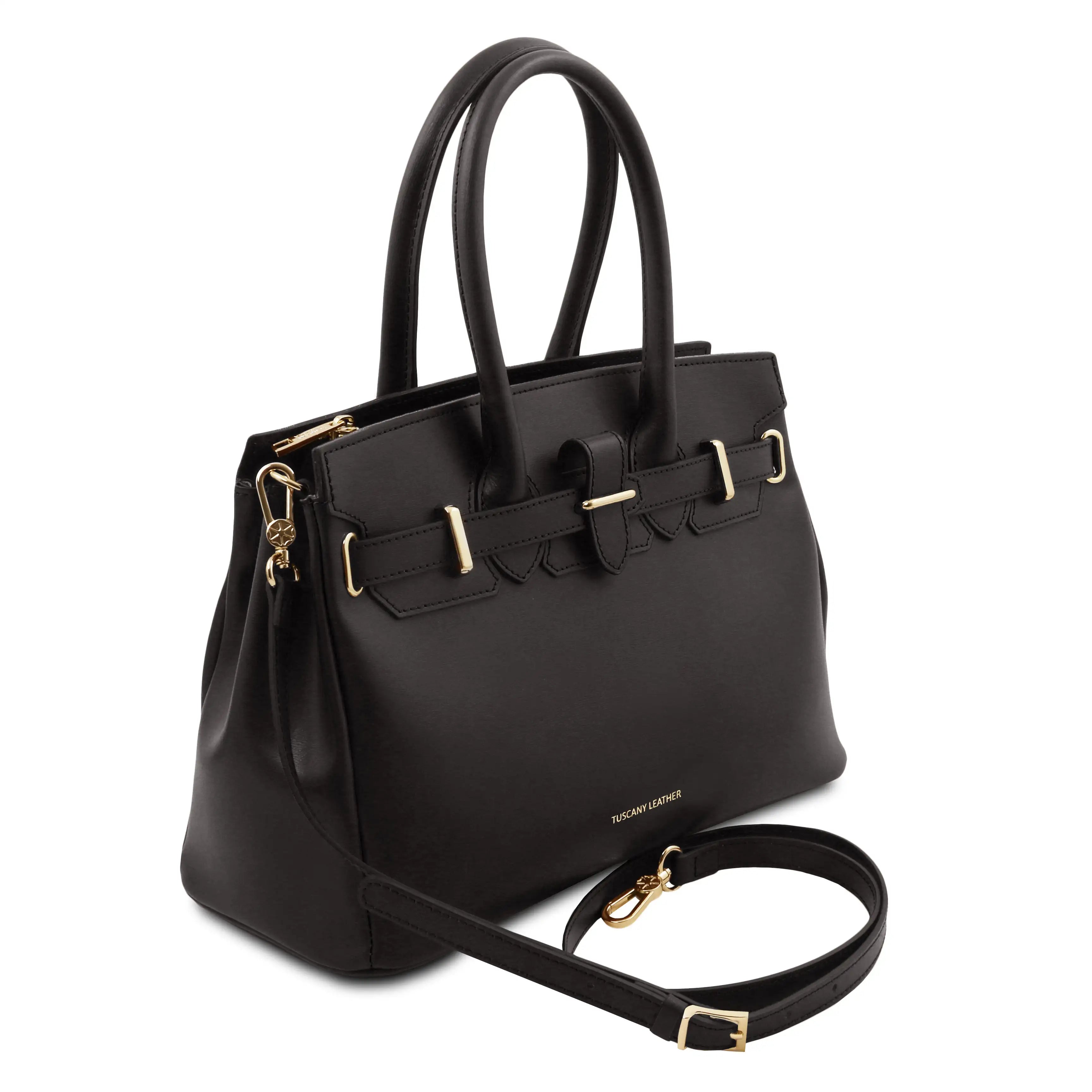 A black leather handbag with gold-tone hardware, featuring dual top handles, a structured rectangular body, and a detachable shoulder strap, shown on a plain white background.