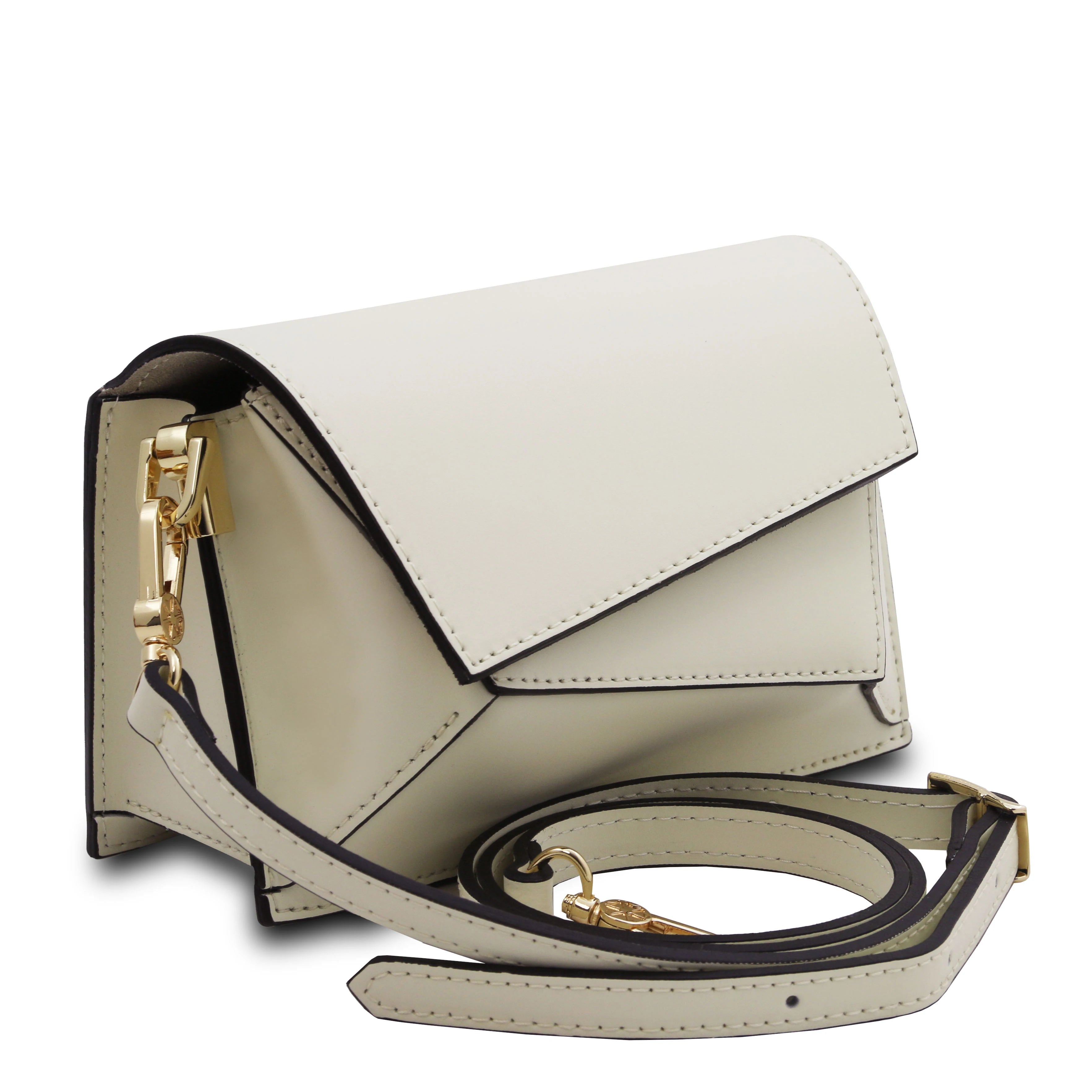Front angled view TL Leather Assymetrical Shoulder Bag in Beige showing bag sa a clutch sitting near its deatchable shoulder strap