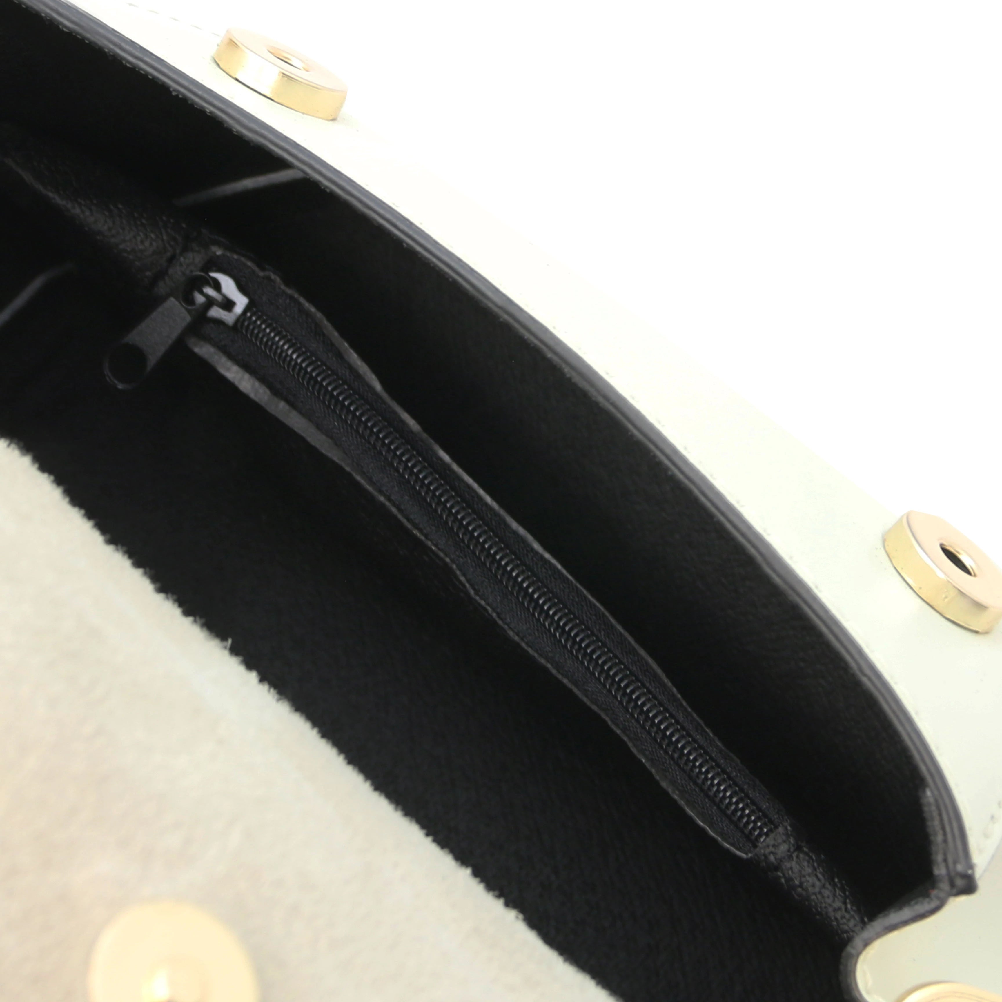 Interior zip pocket view TL Leather Assymetrical Shoulder Bag in Beige showing magnetic button closures