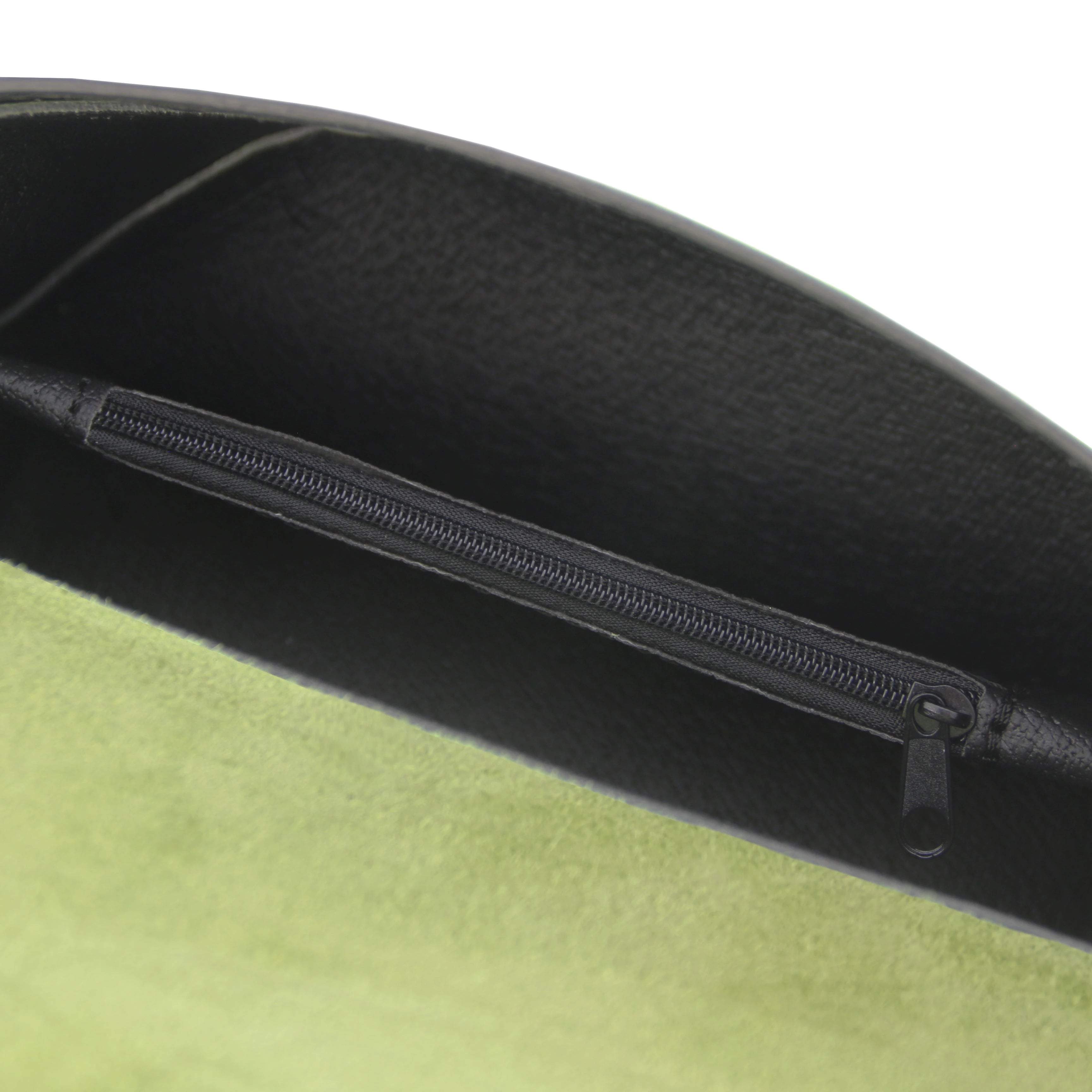 Interior zip pocket view TL Leather Assymetrical Shoulder Bag in Green showing black interior