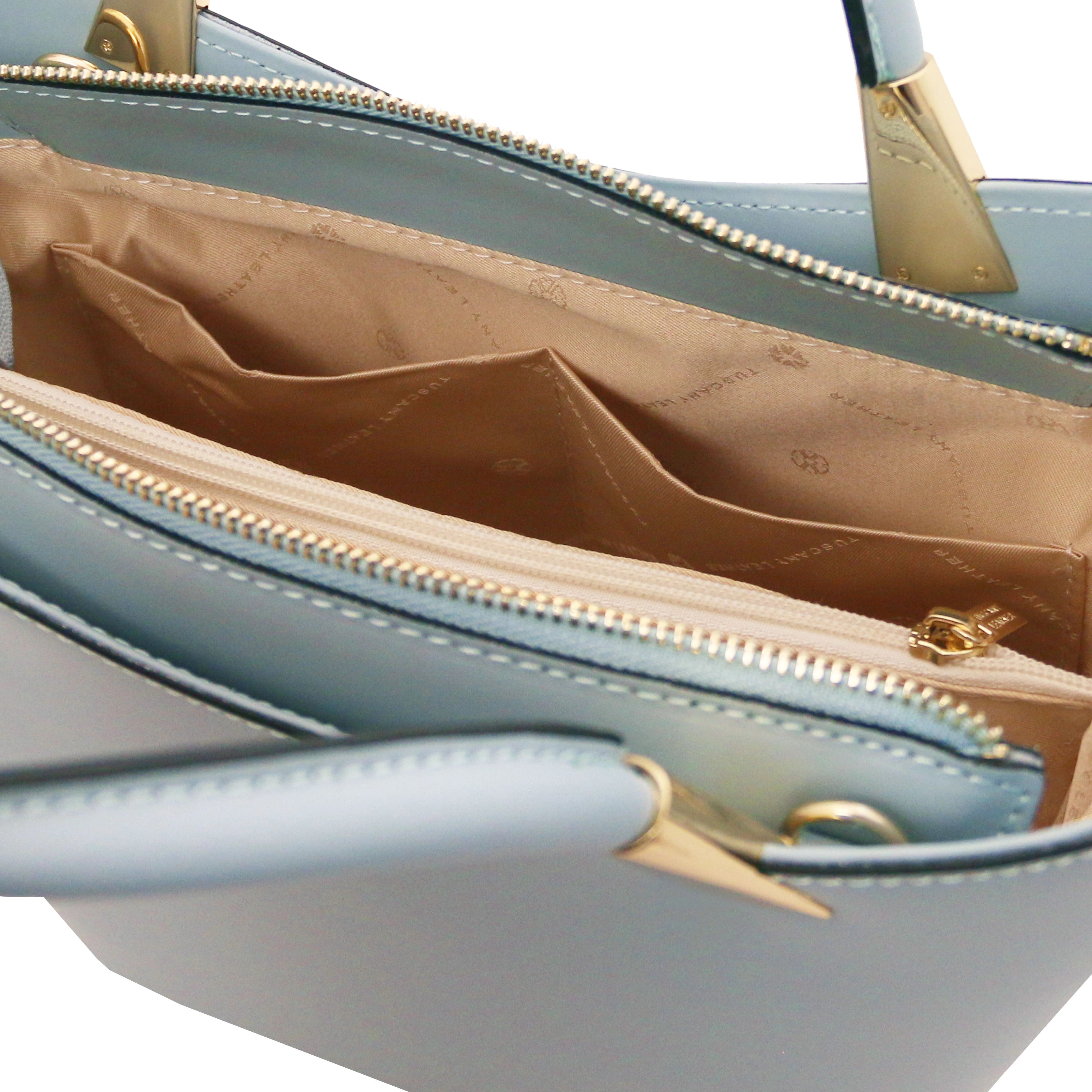 TL Bag Italian Leather Handbag in Light Blue interior view showing centered zippered, beige lining, compartment and open pockets