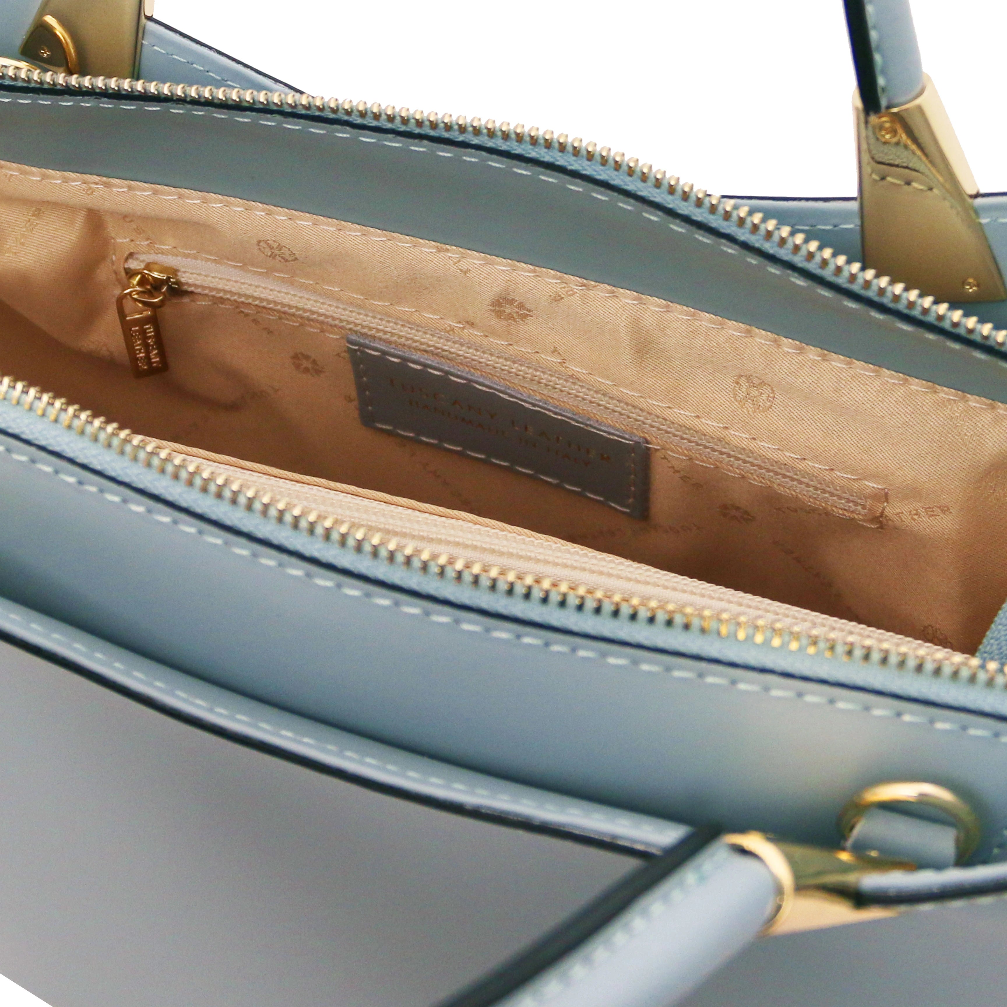 TL Bag Italian Leather Handbag in Light Blue interior view showing centered zippered compartment, beige lining and zippered pocket
