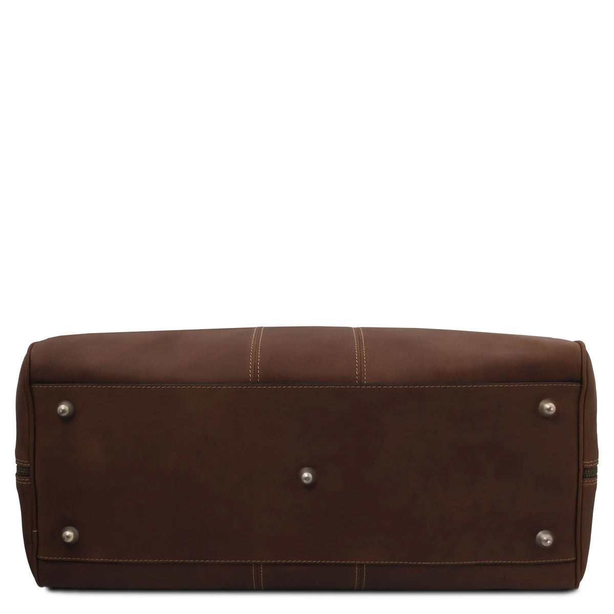 The bottom view of a dark brown leather travel bag , showing the stitched seams, silver metal protectors on a solid white background.