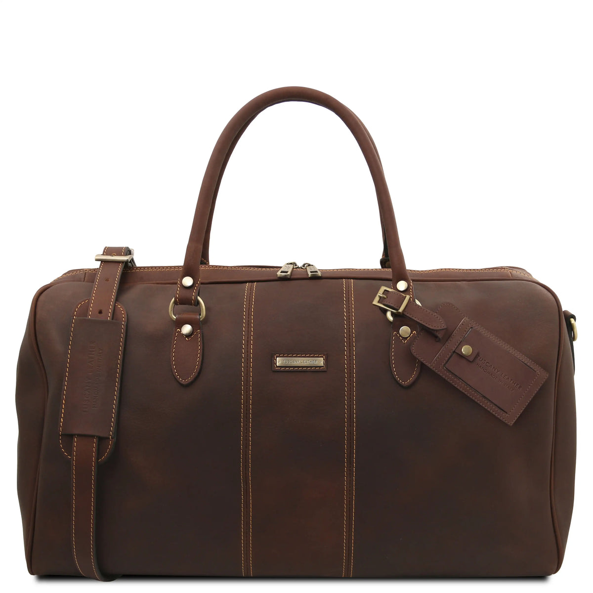 A dark brown leather duffel bag with dual top handles, gold-tone hardware, contrast stitching, and an attached leather luggage tag, shown on a plain white background.
