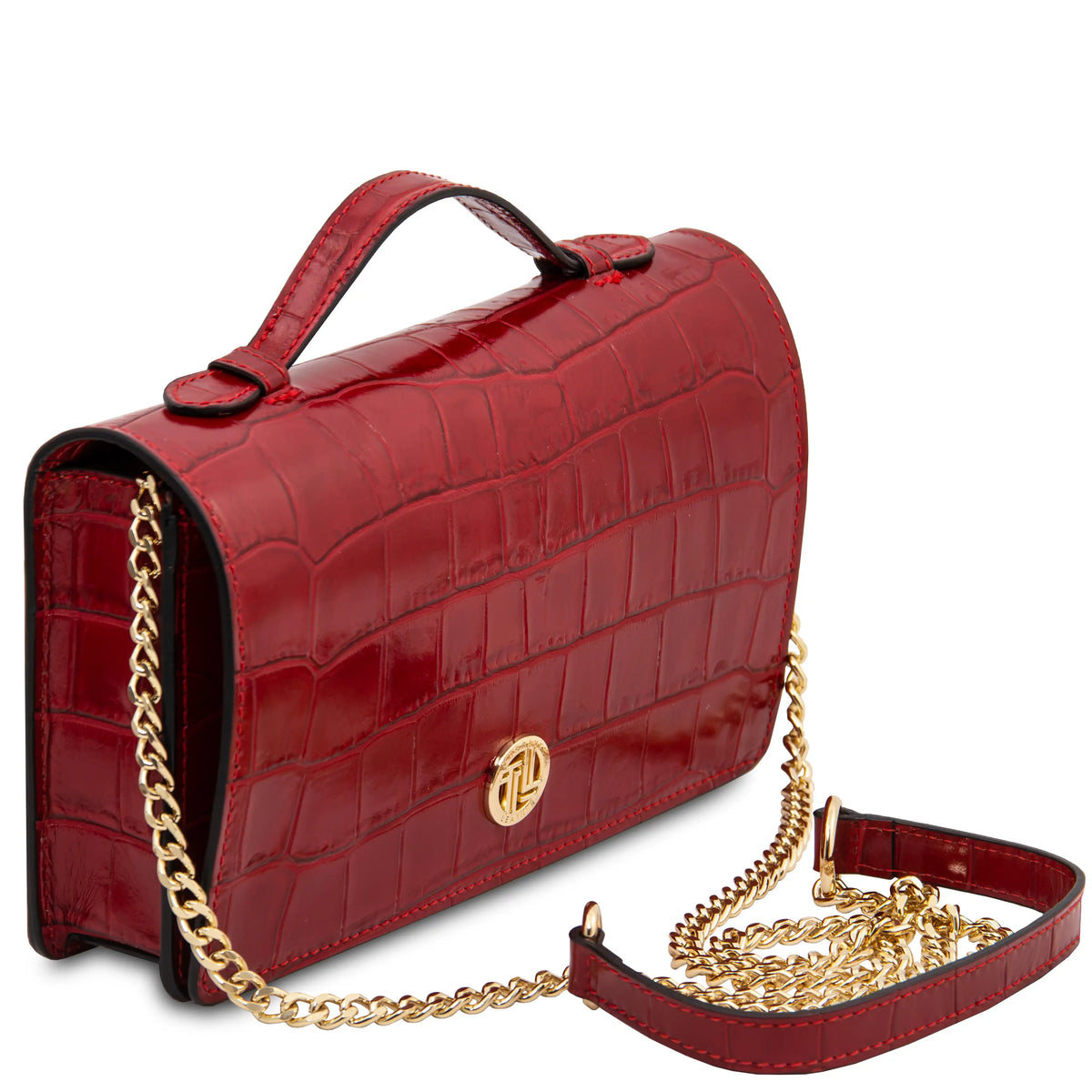 A red crocodile-embossed leather handbag with a top handle, gold chain strap, and a gold circular logo clasp, shown on a white background.