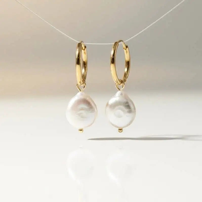 Amalfi Bianca 2-in-1 Huggies 18K Gold Plated & Keshi Pearls hanging on a natural backround