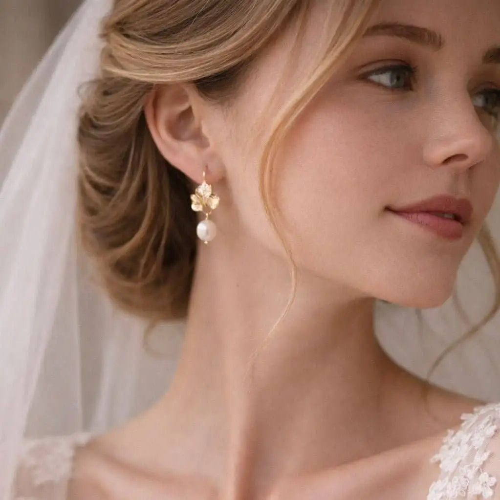 A bride with her hair up wearing the Amalfi Golden Daisy Earrings