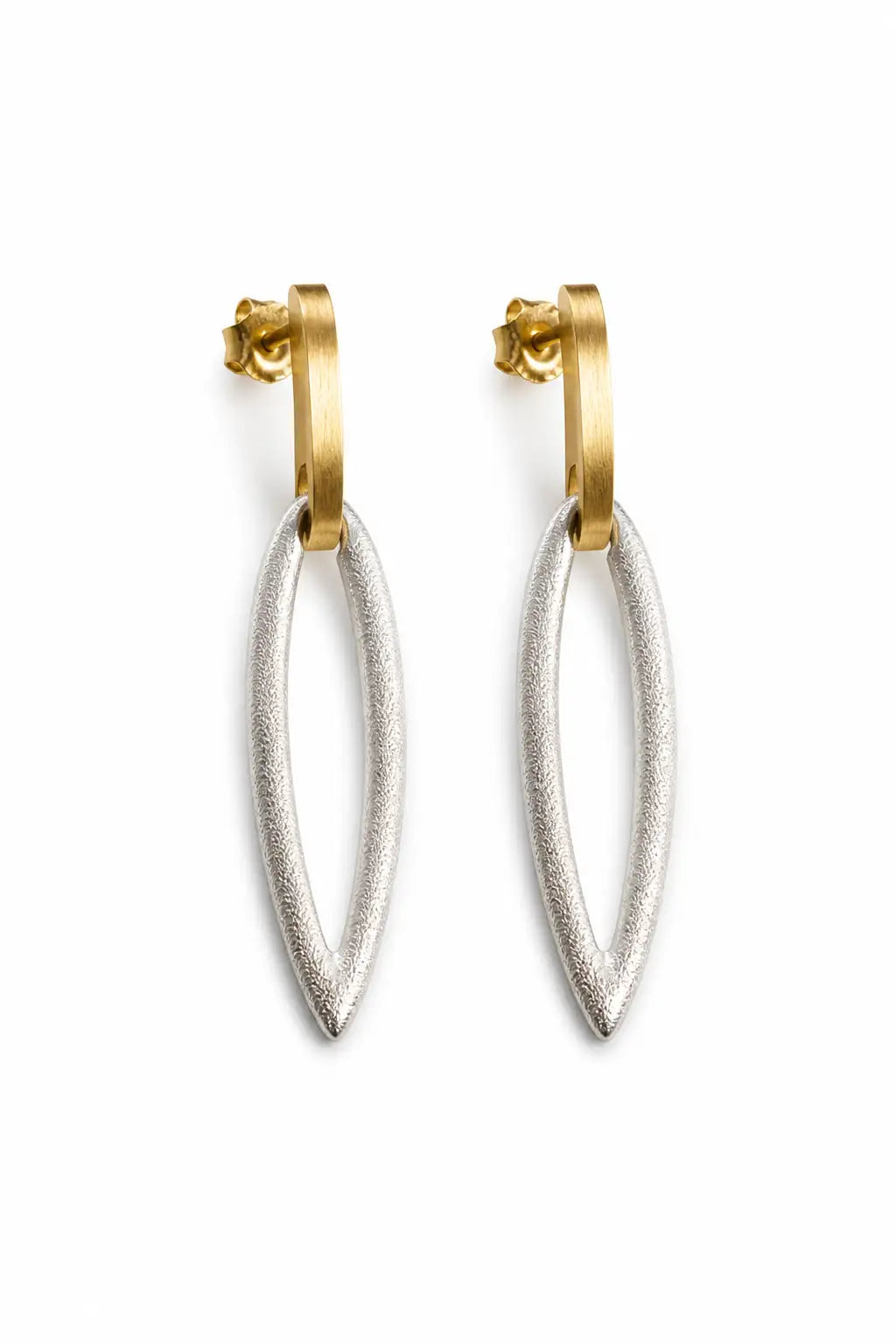 A pair of gold and silver drop earrings with textured oval dangles and polished gold hoops, shown on a plain white background.