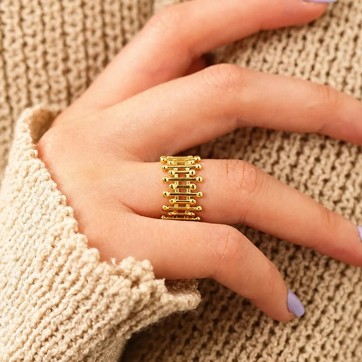 Aurora Quad-Bar Adjustable Gold Ring on a women's hand