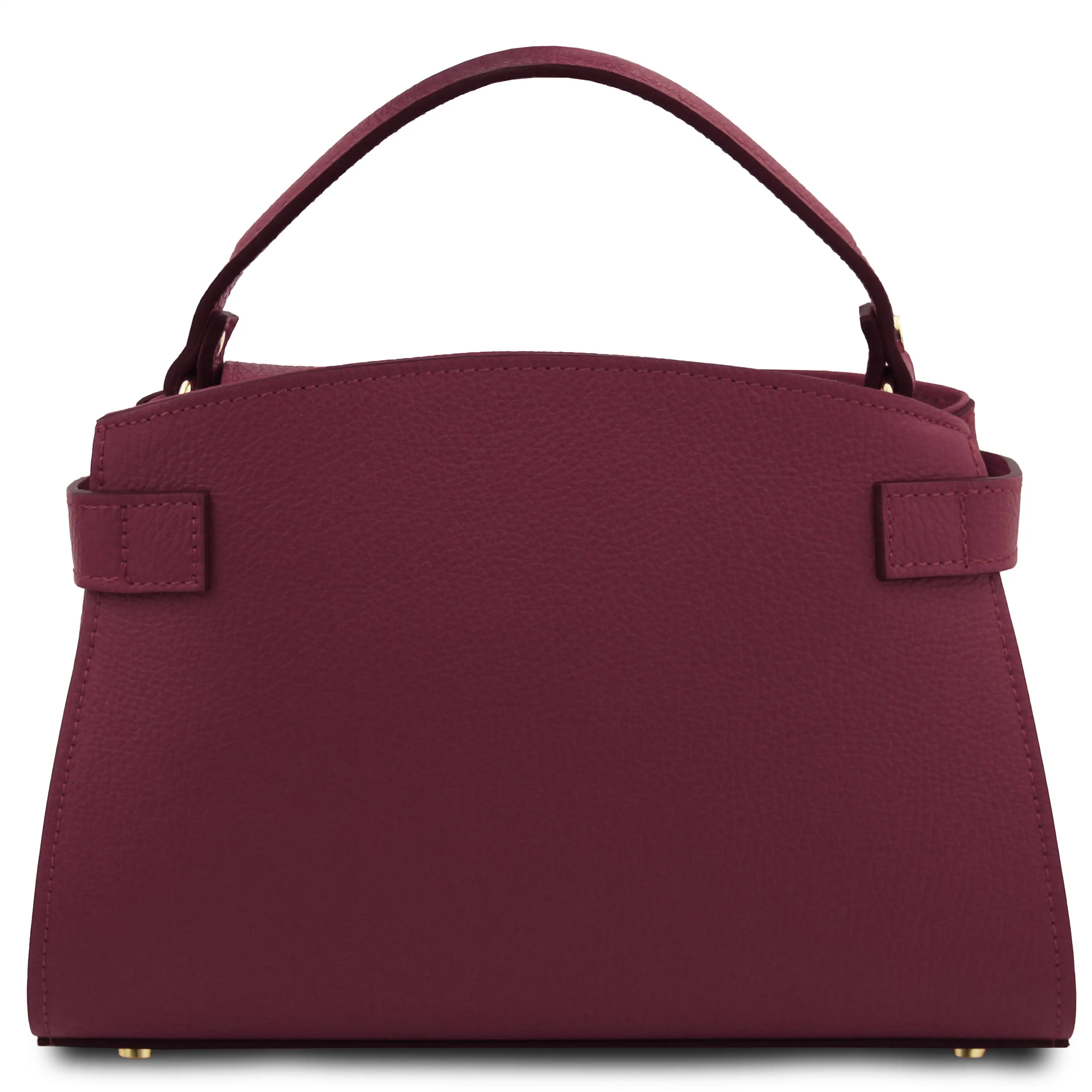 A burgundy pebbled leather handbag with a top handle, side strap details, and gold-tone hardware, shown against a plain white background.