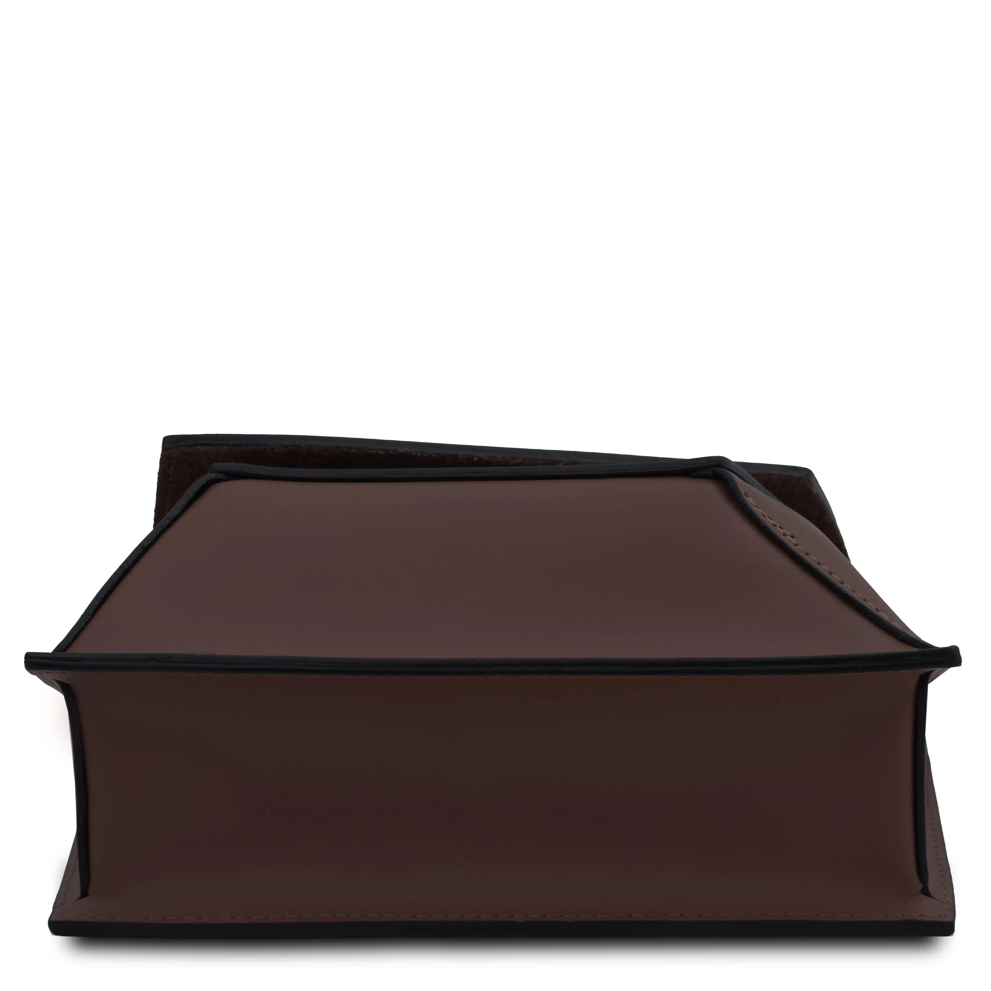 Bottom view chocolate leather bag with raw edges