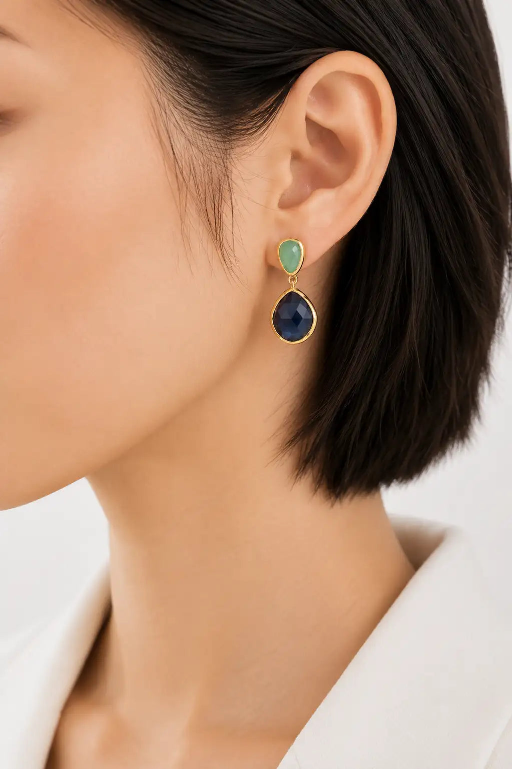 Left profile of a woman wearing the Daleyza Drop Earrings with Blue Iolite & Aqua Chalcedony.