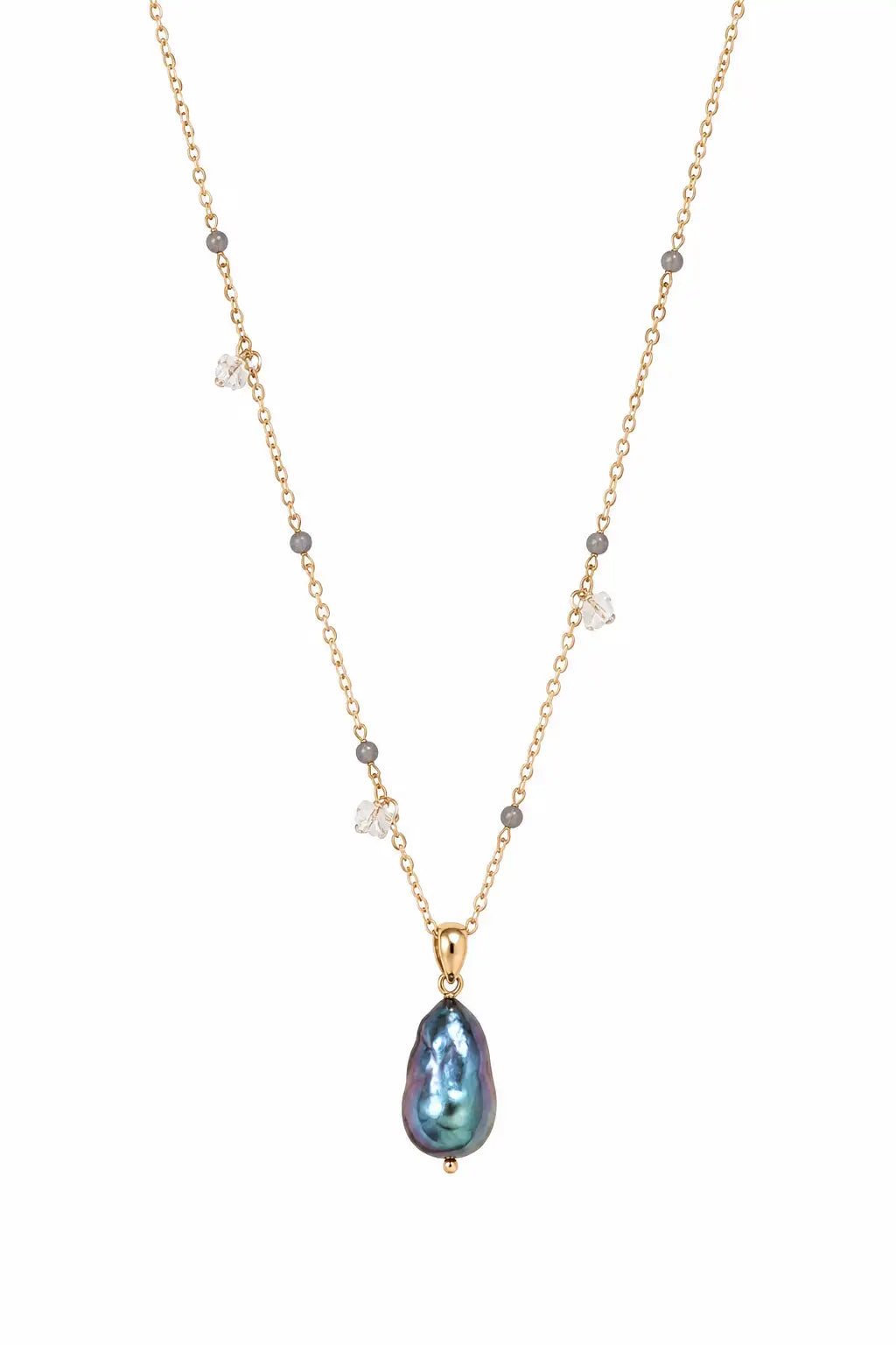 A delicate gold chain necklace featuring a teardrop-shaped iridescent blue-green pearl pendant, accented with small gray beads and clear crystal charms, shown against a plain white background.