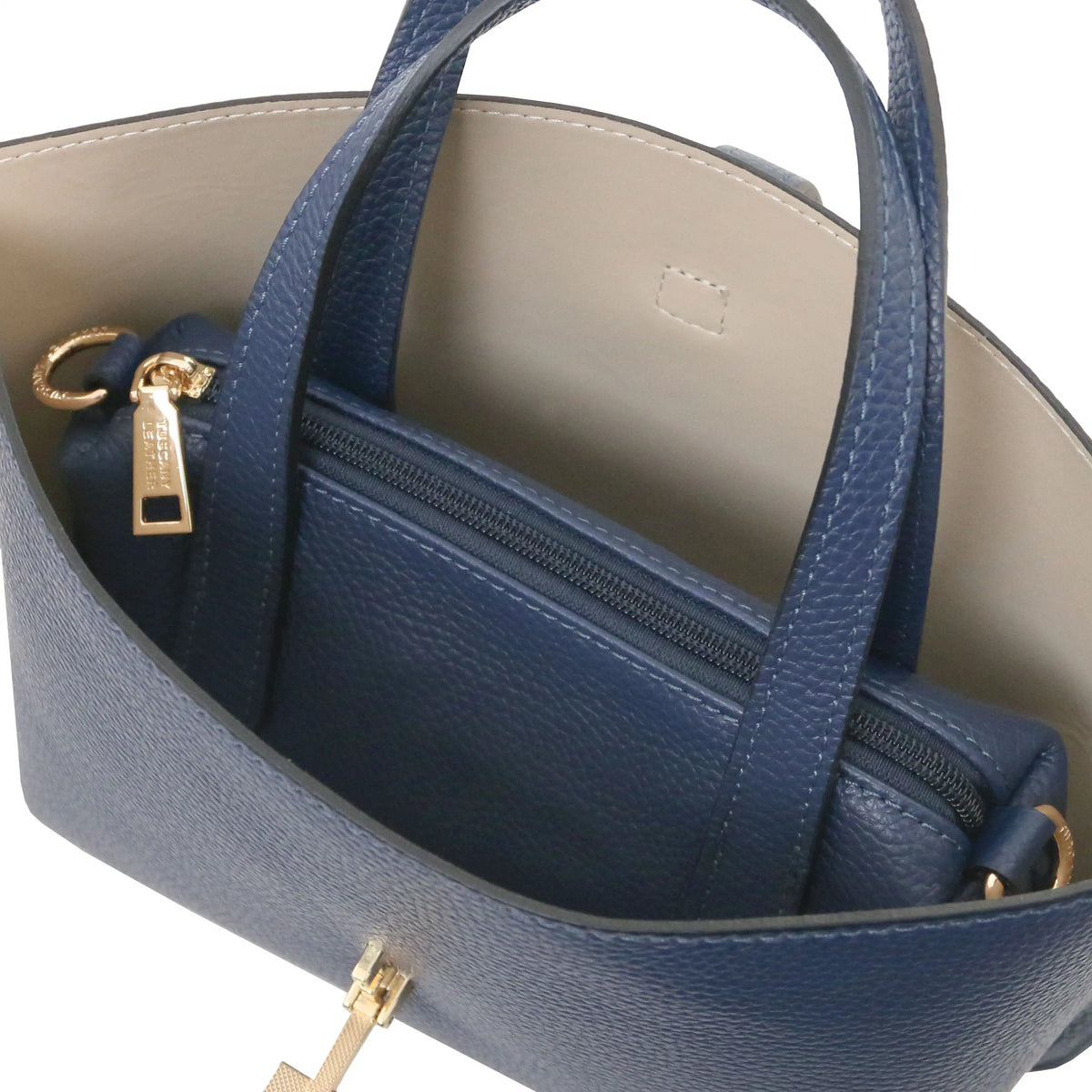 Interio beige lining view Agatha Leather Handbag in dark blue with central zipped compartment