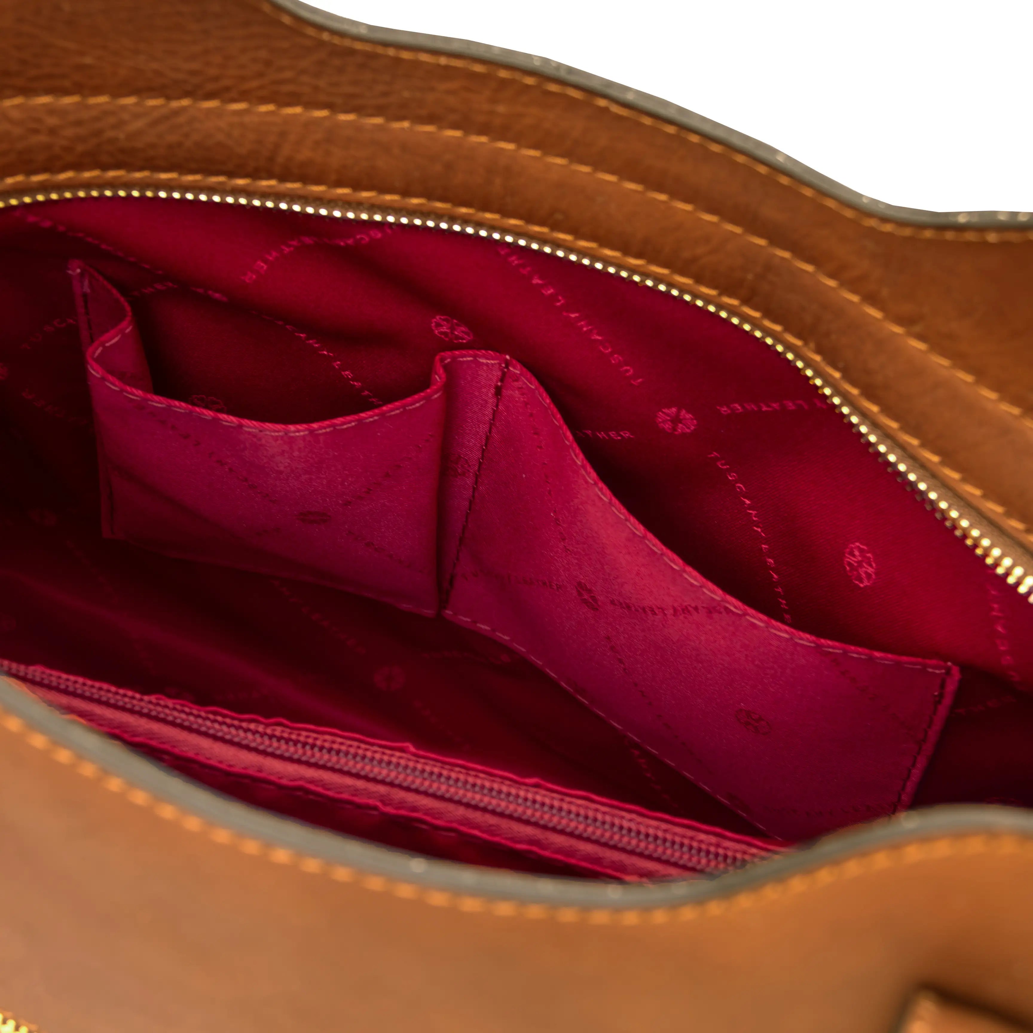 Interior opened pocket red lining view Olimpia Leather Tote Bag in Natural
