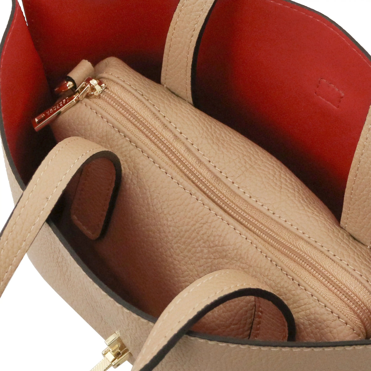 Interior red lining view Agatha Leather Handbag in caramel eit central zipped compartment