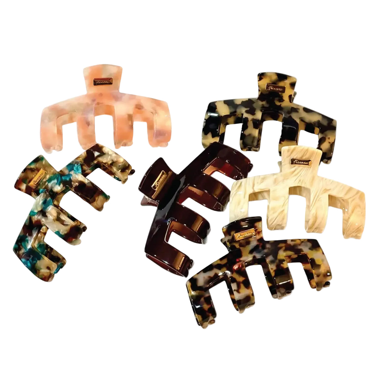 Six hair claw clips in assorted tortoiseshell and marbled patterns, arranged on a plain white background.