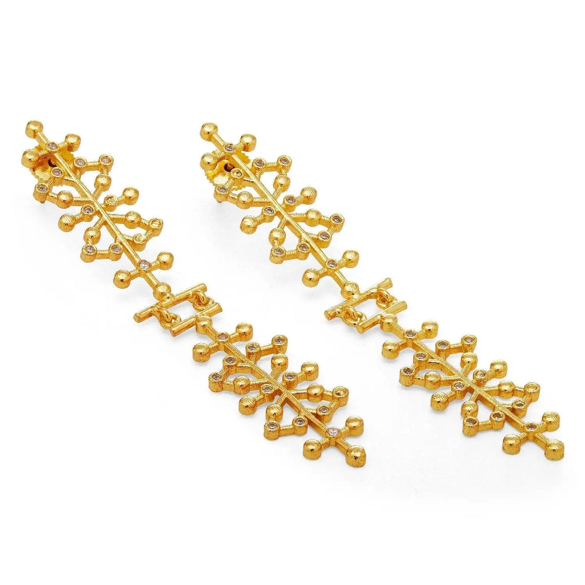 Pair of gold statement earrings with an intricate, branching dendritic pattern and small clear cz accents with intricate designs on a white background