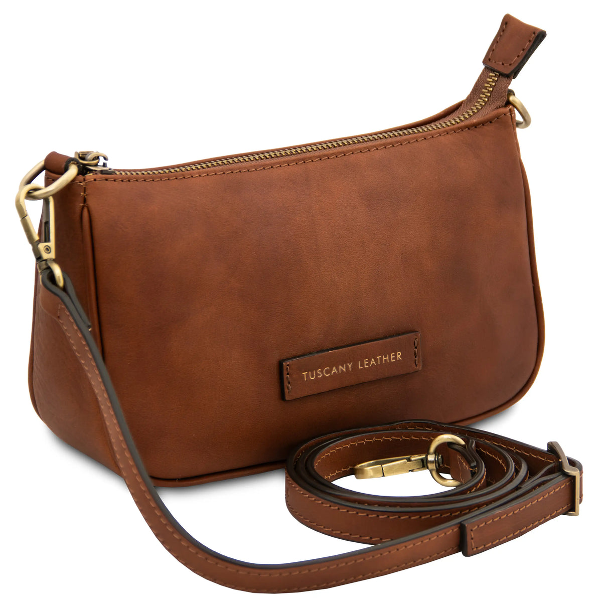 Brown leather handbag with a strap on a white background