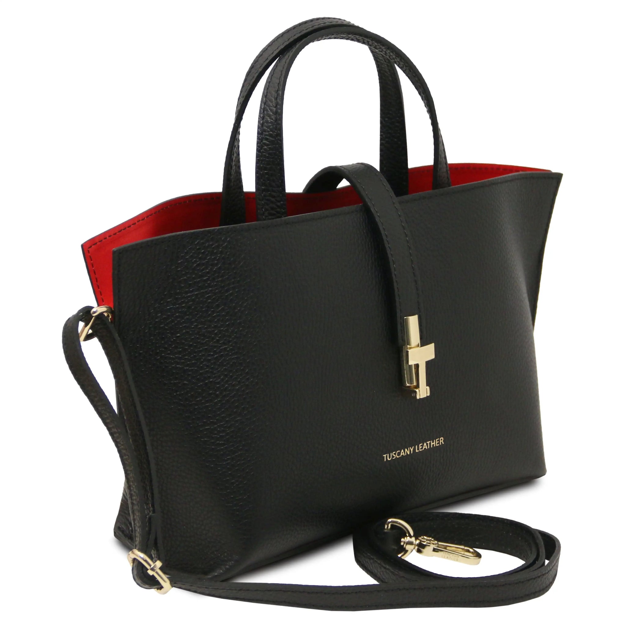 Black handbag with gold accents, red interiorand detachable crossbody strap on a white background