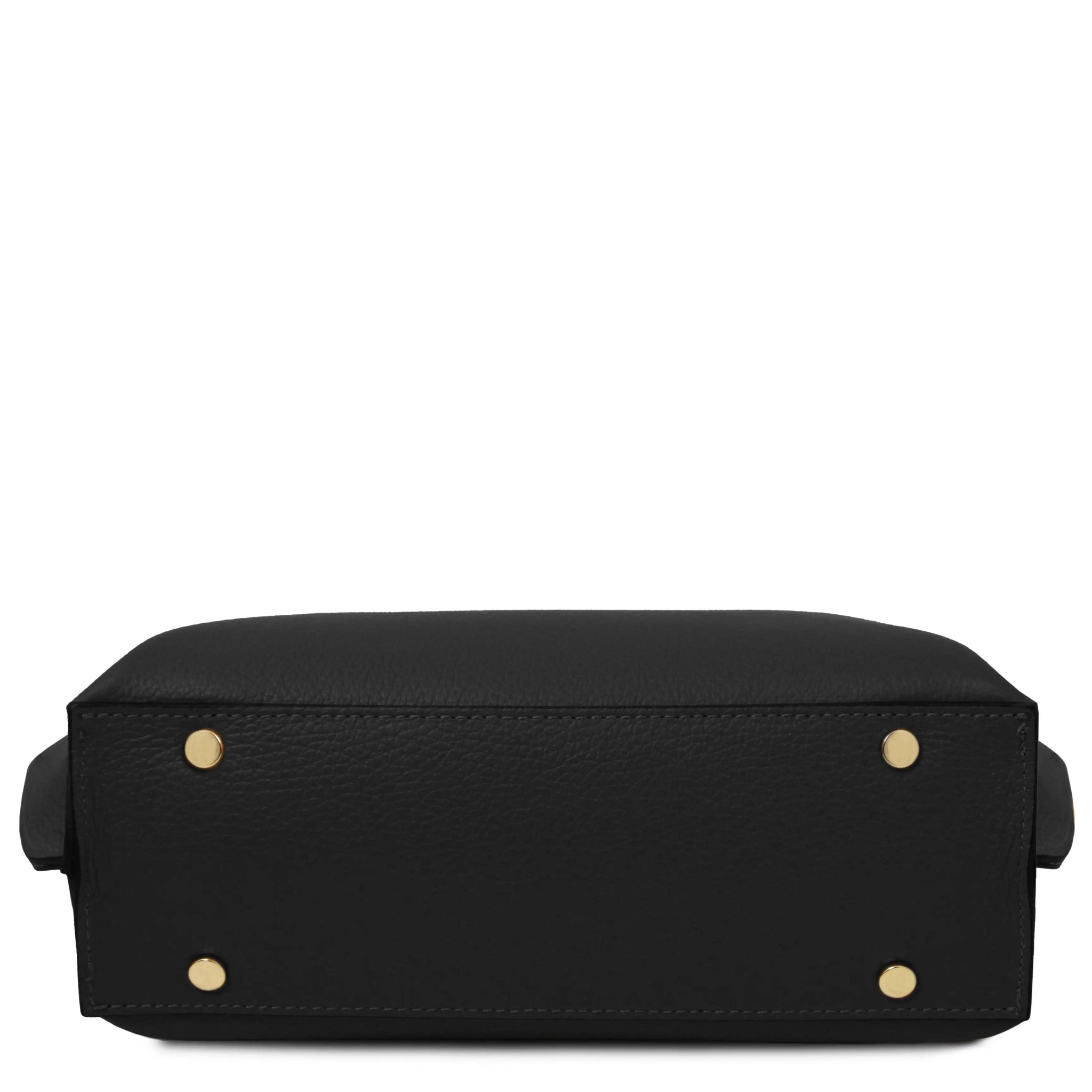 Bottom view of black leather bag with gold protective feet on a white background