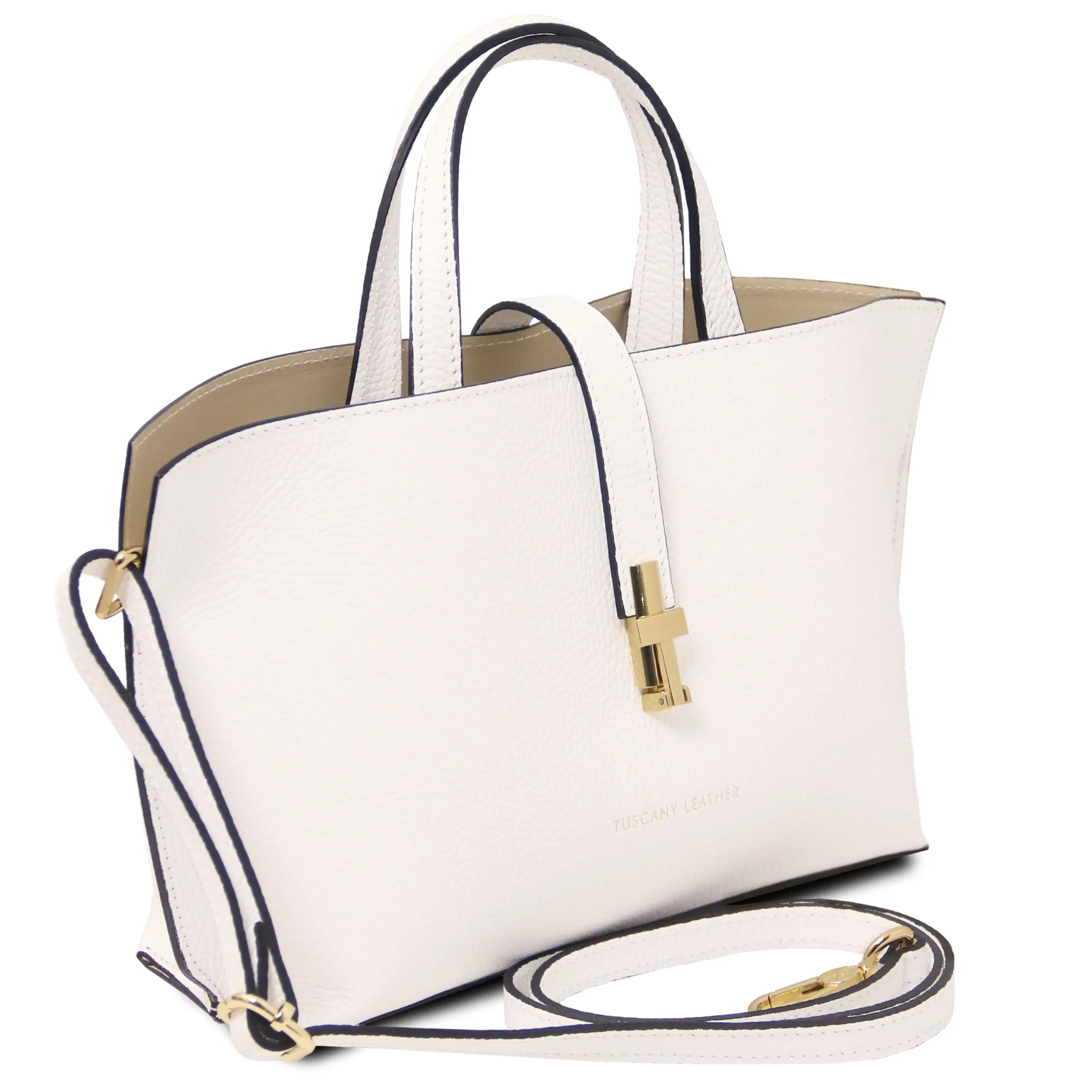 White handbag with gold twist lock and detachable shoulder strap on a white background