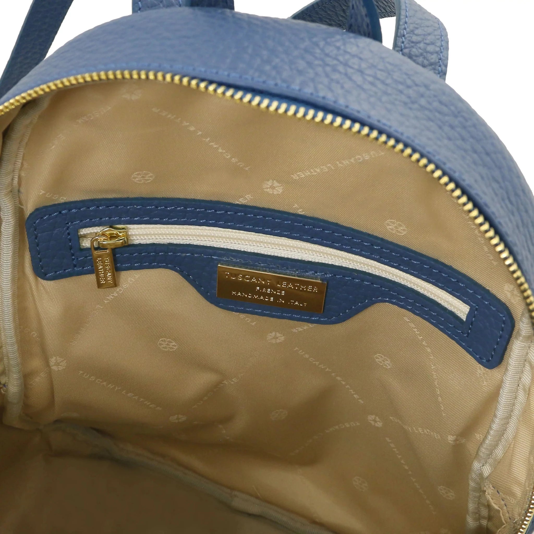 Interior zip pocket view Arco Italian Pebbled Leather Backpack in Denim with beige lining