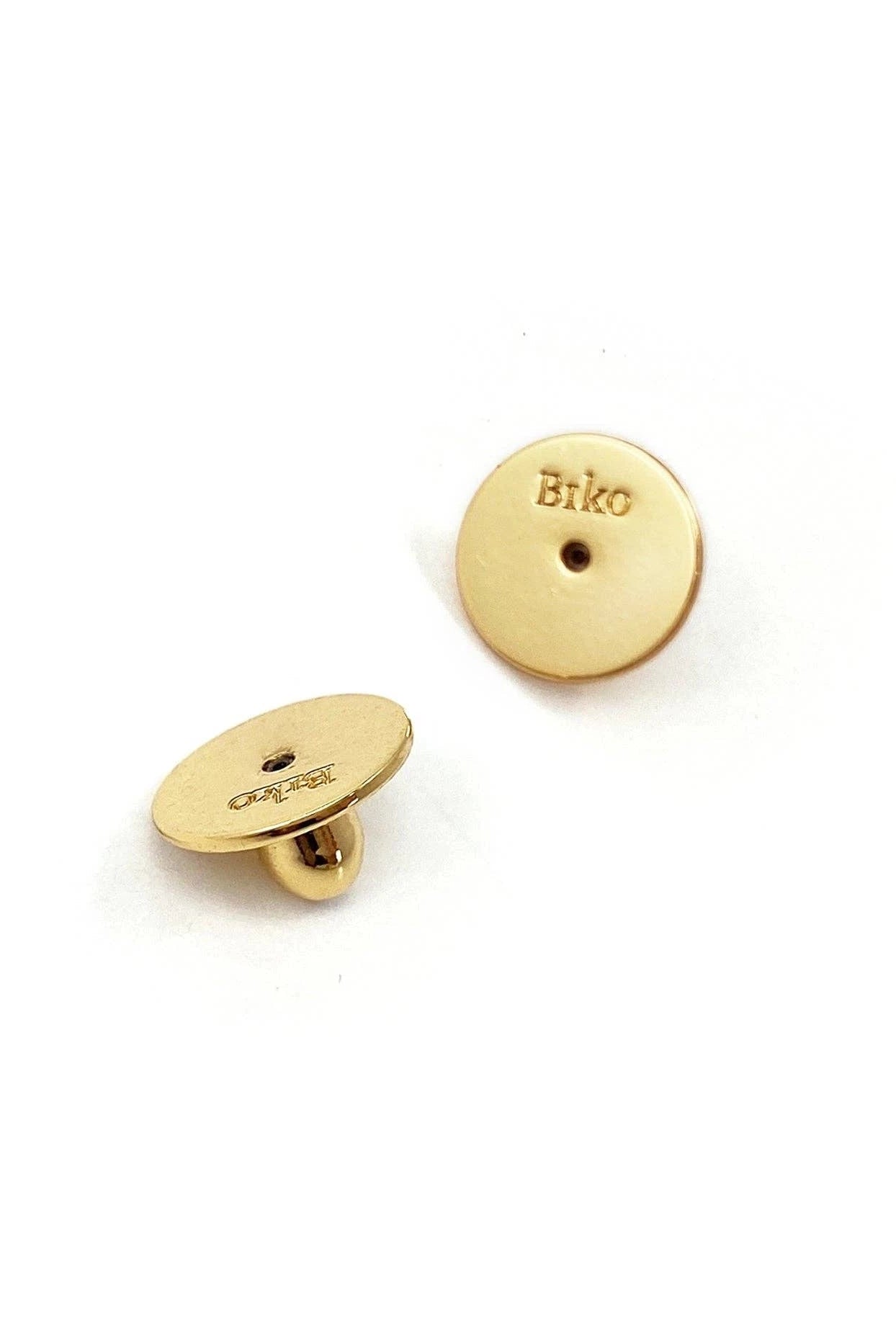 Aya Infinity Gold Post Earring safety backs on white background with Biko branding