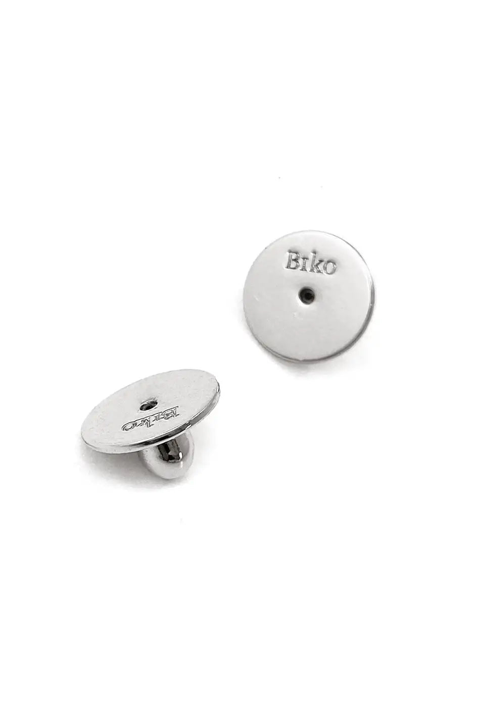 Silver earring backs with 'Biko' branding on a white background