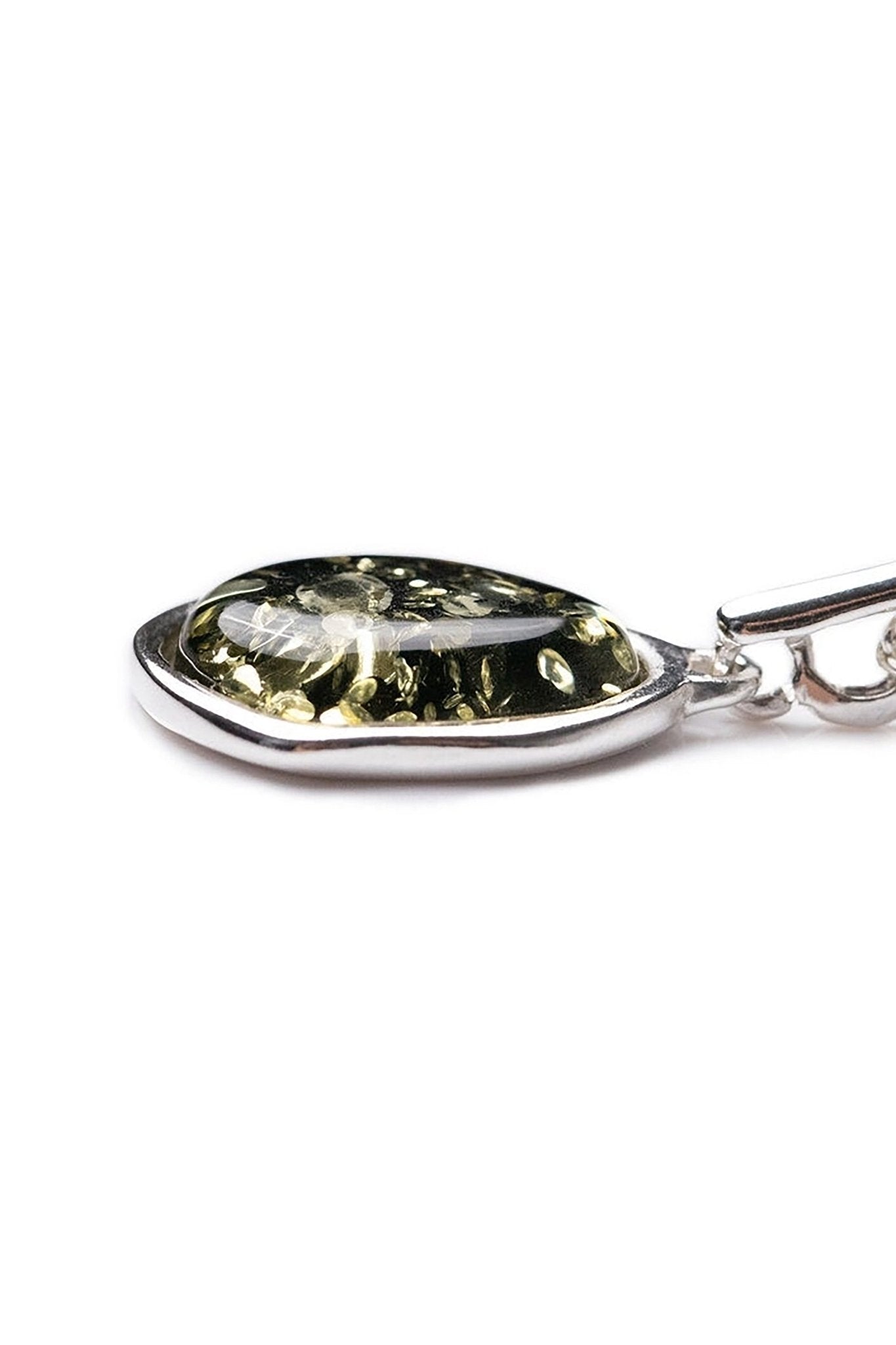 Close up of the Green Amber Element Silver Pendant on a white background