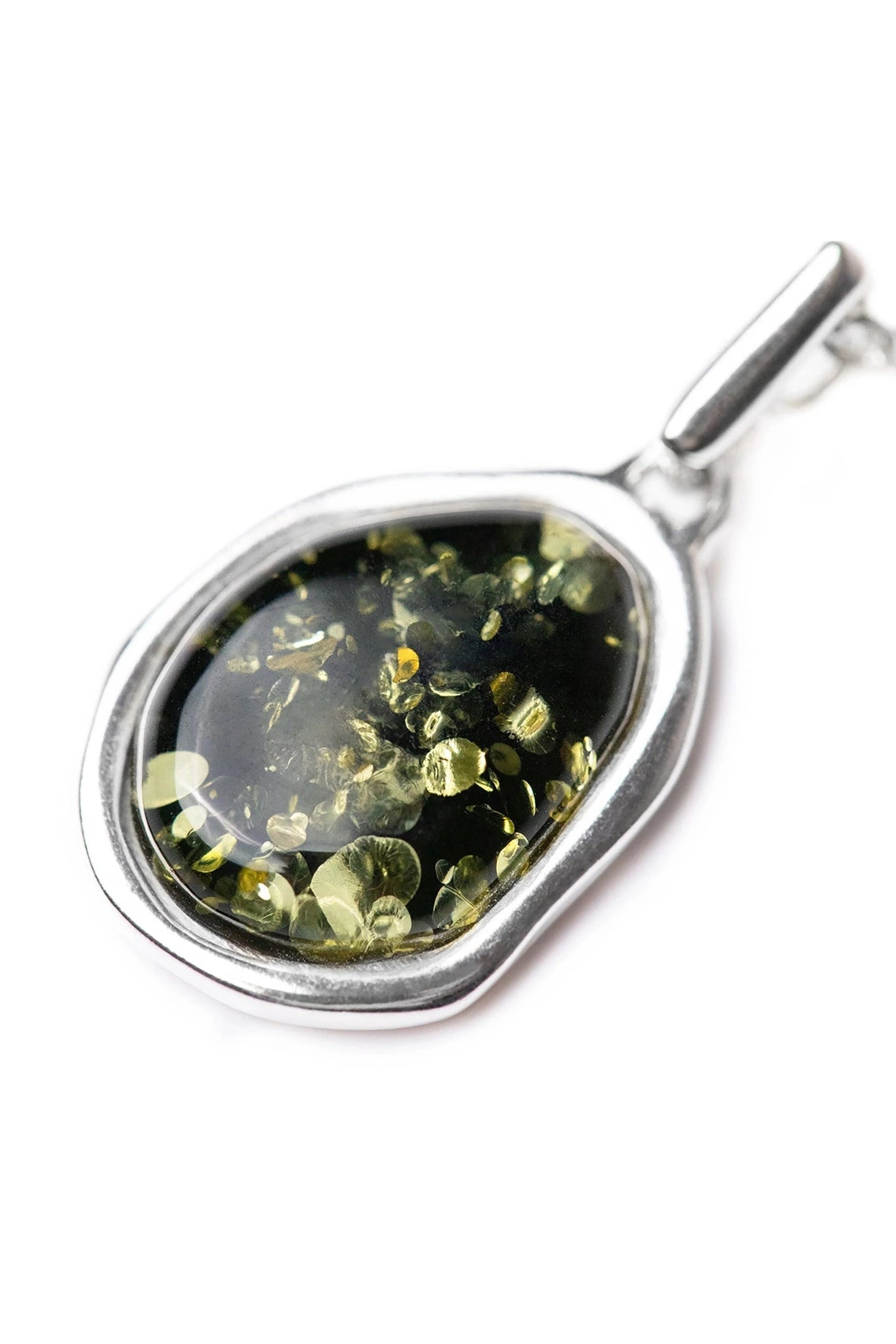 Close up of the Green Amber Element Silver Pendant on a white background