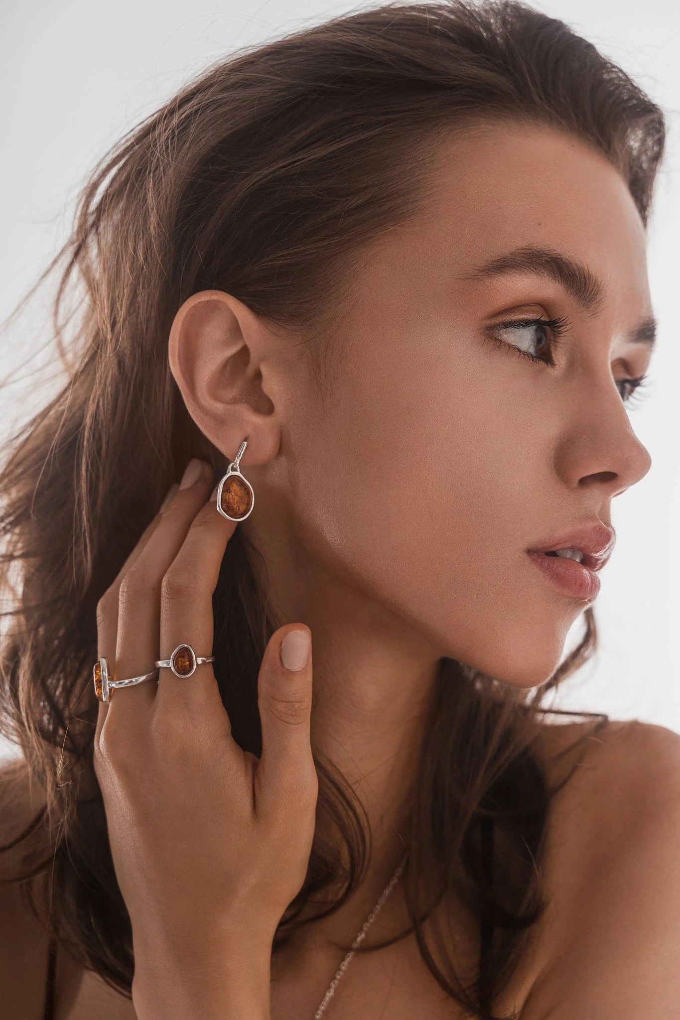 Honey Amber Asymmetrical Drop Earrings and adjustable ring on model