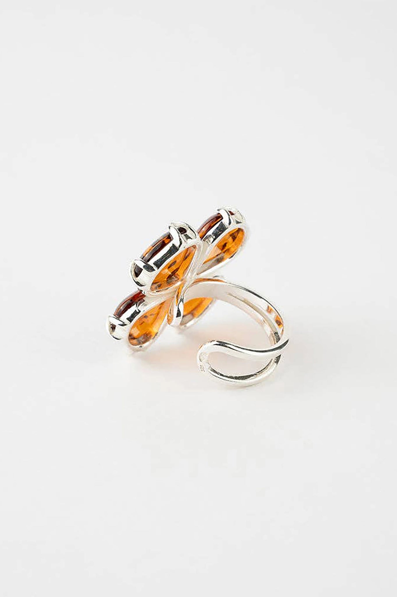 Baltic Honey Amber Daisy Adjustable Sterling Silver Ring on a white background
