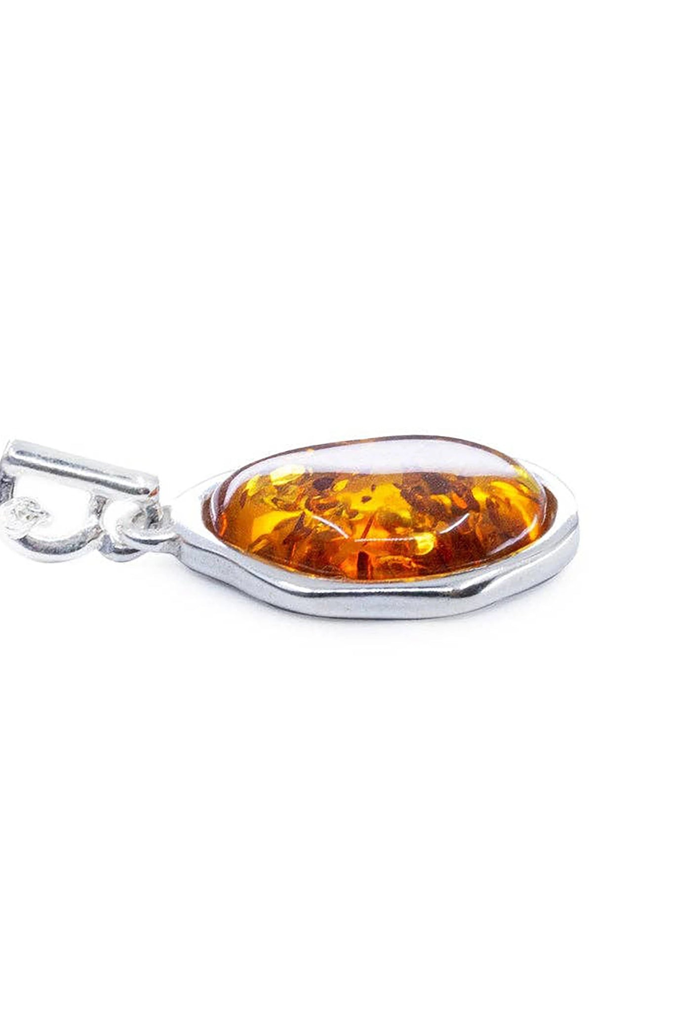Close up of the Baltic Honey Amber Element Silver Pendant on a white background