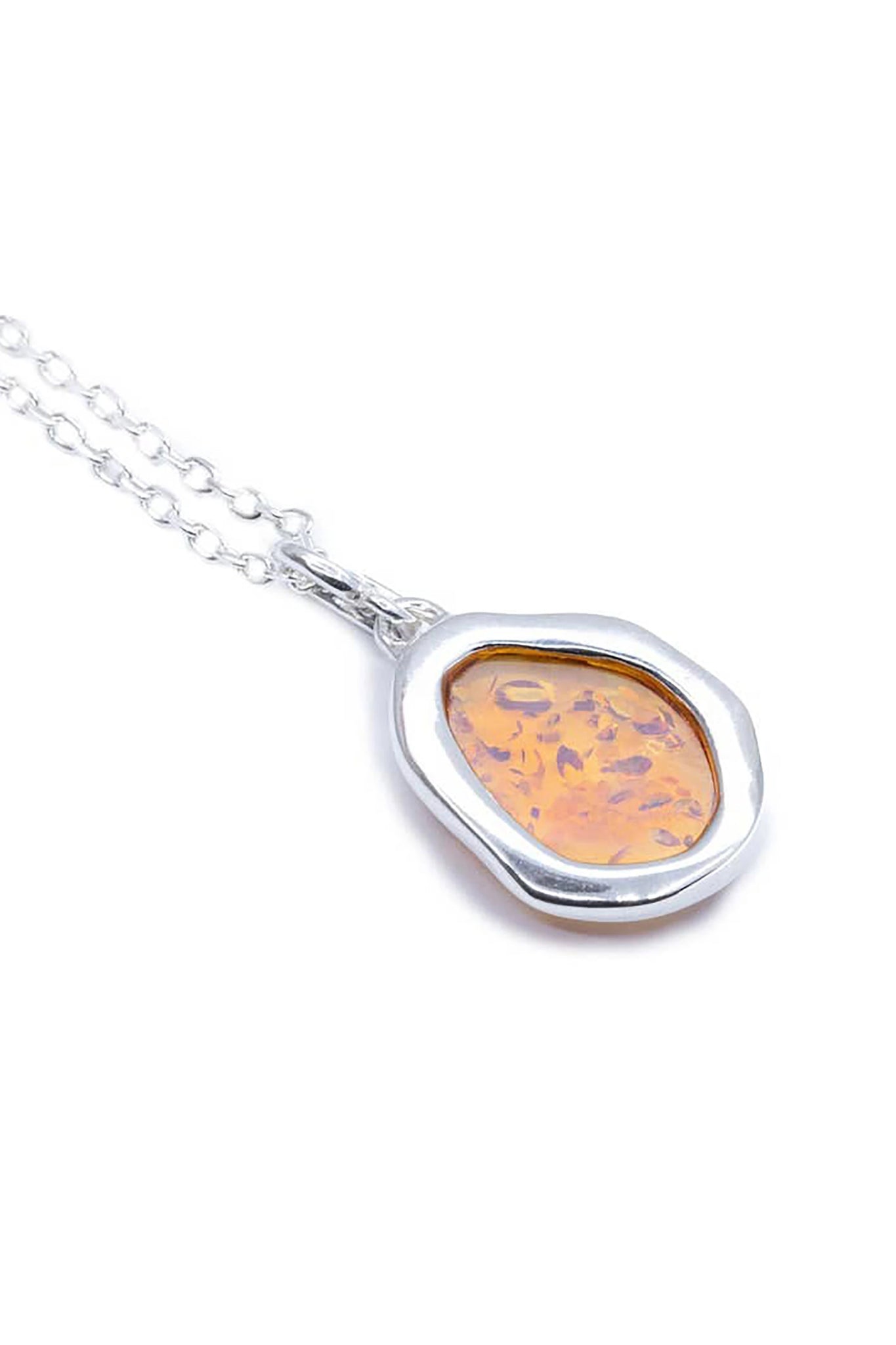 Close up of the back of the Baltic Honey Amber Element Silver Pendant on a white background