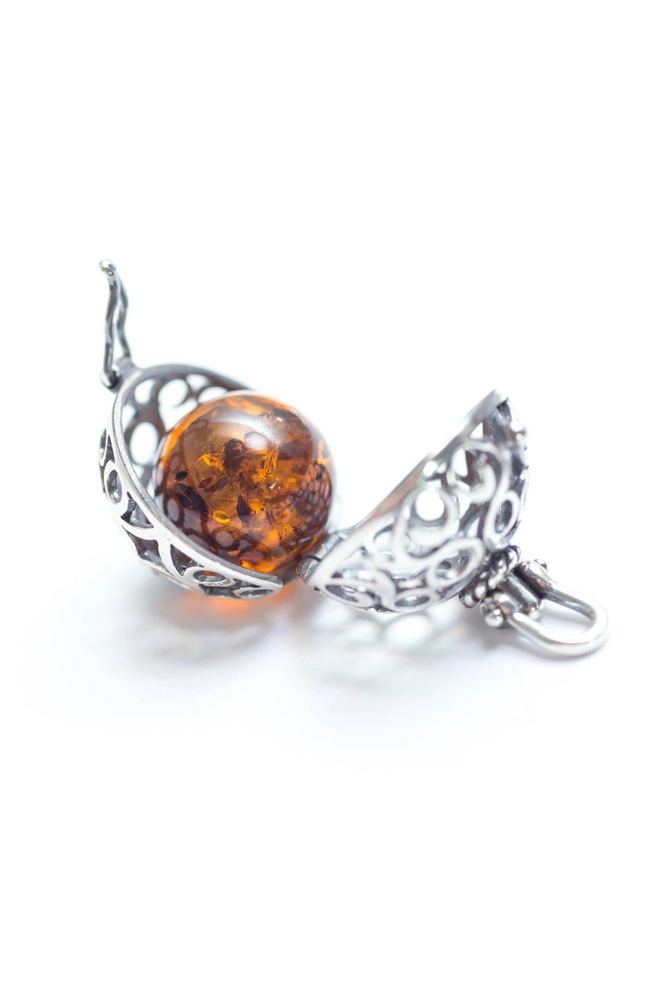 Baltic Honey Amber Sterling Silver Filigree Locket Necklace pendant is opened showing the amber ball gem that is removable