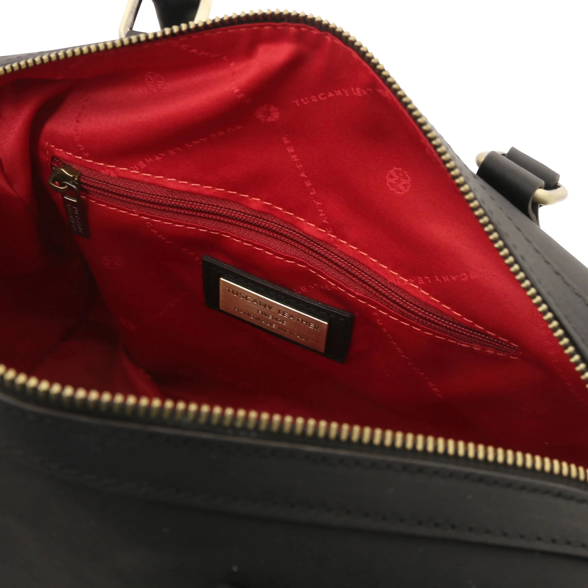 Interior zip pockets view Barrique Leather bag in black with red lining