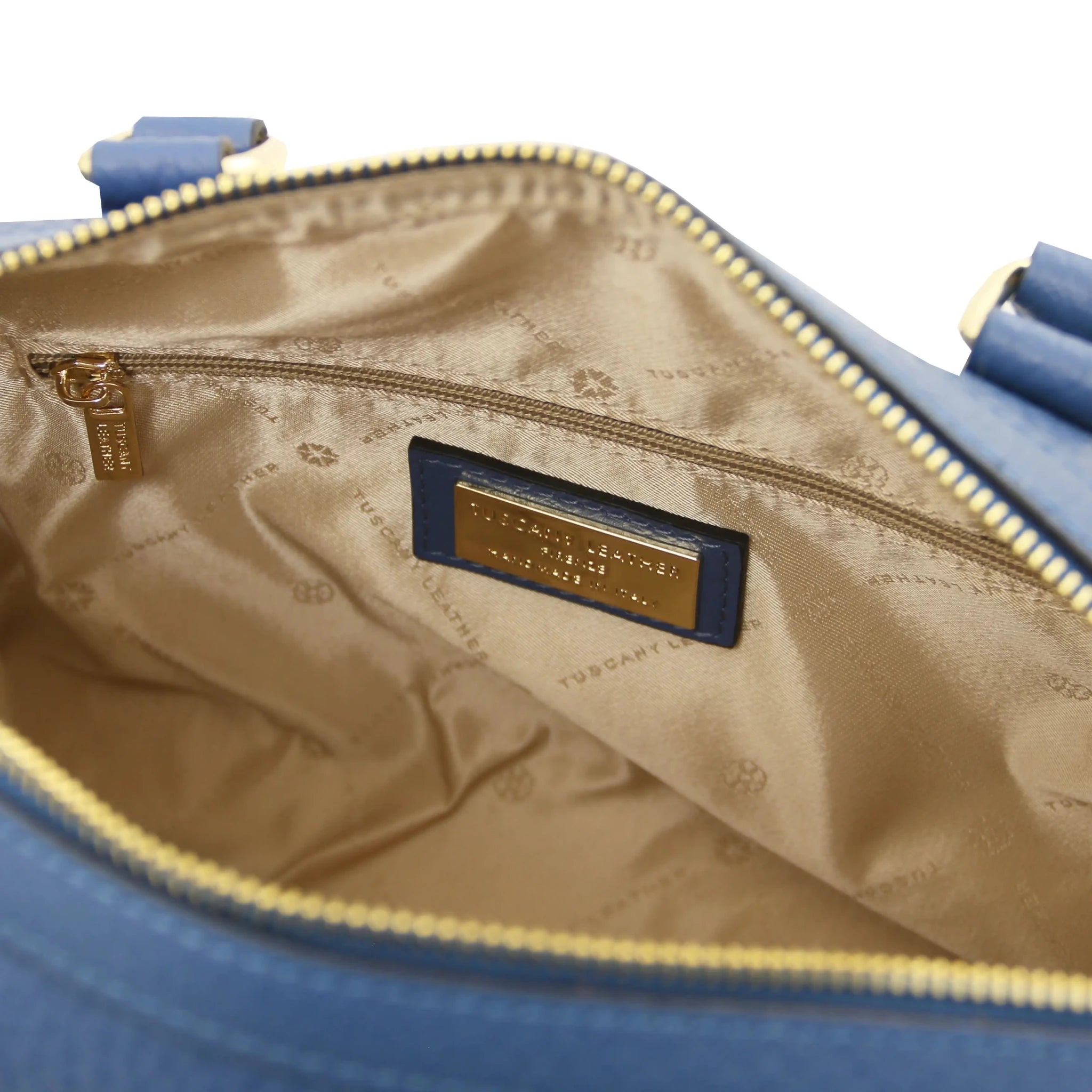 Interior zip pockets view Barrique Leather bag in blue with beige lining