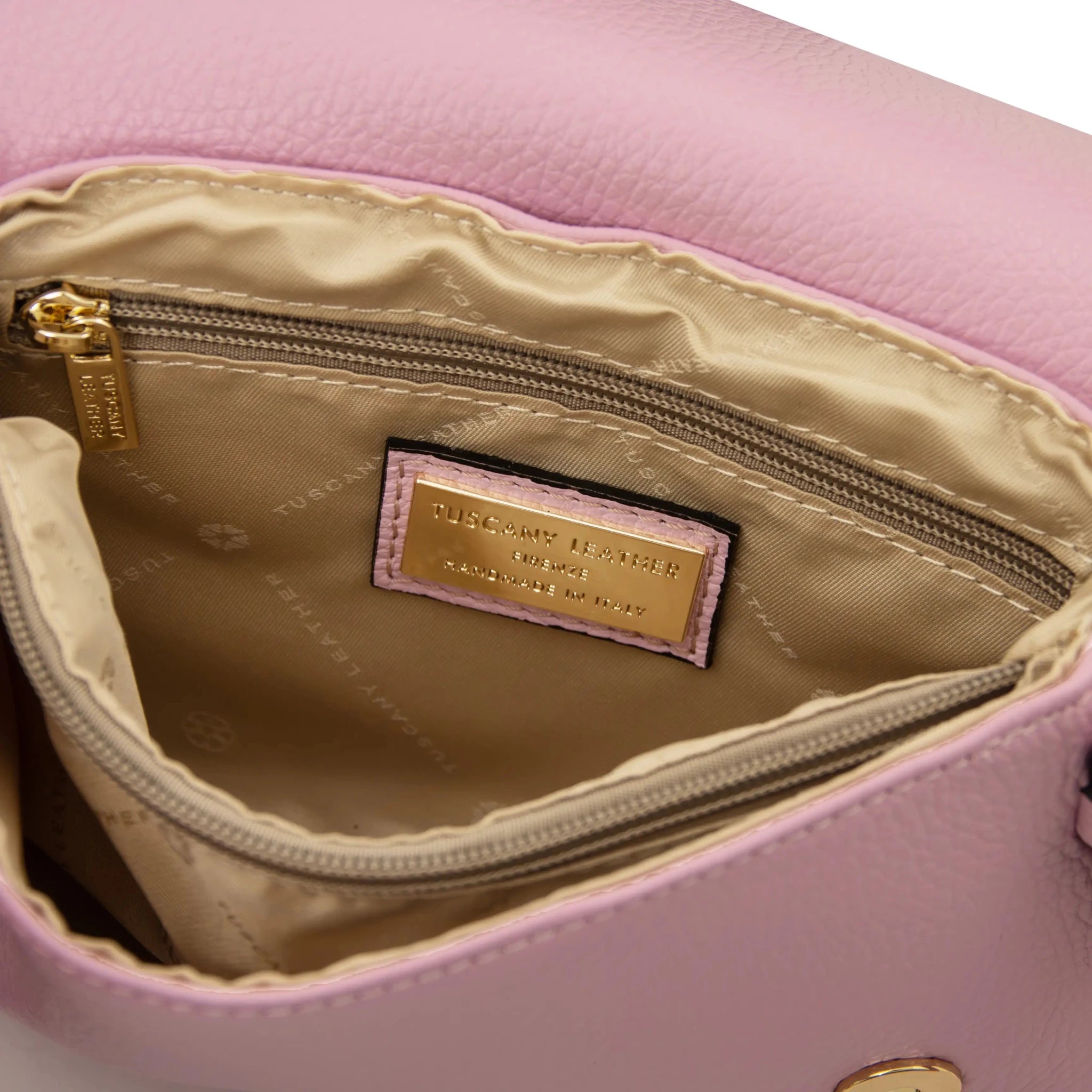 Interior zip and central compartment pockets beige lining view Biscuit Soft Shoulder Bag in ballet pink