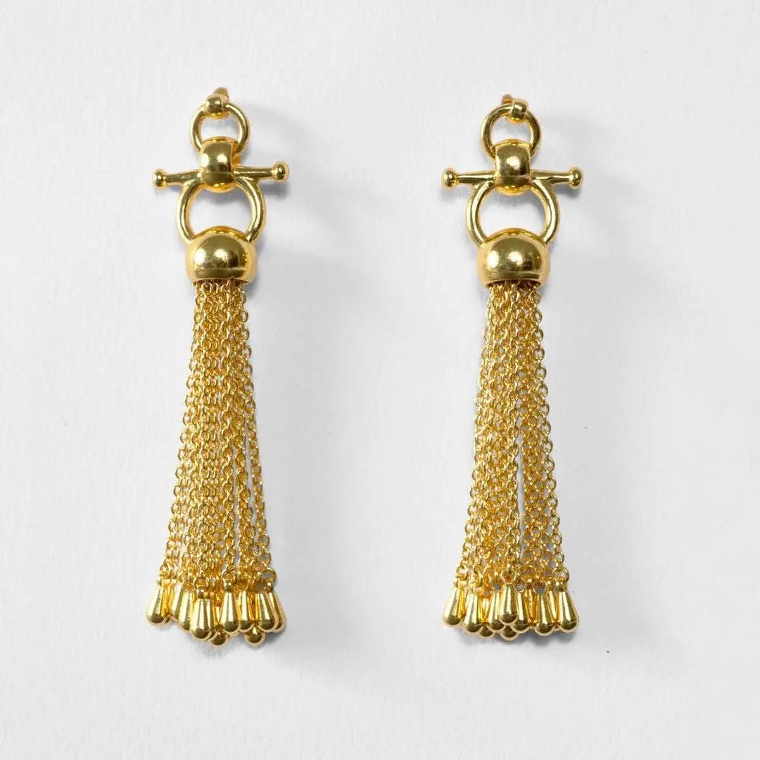 Chantilly Horse Bit Tassel Gold Earrings om a light gray background