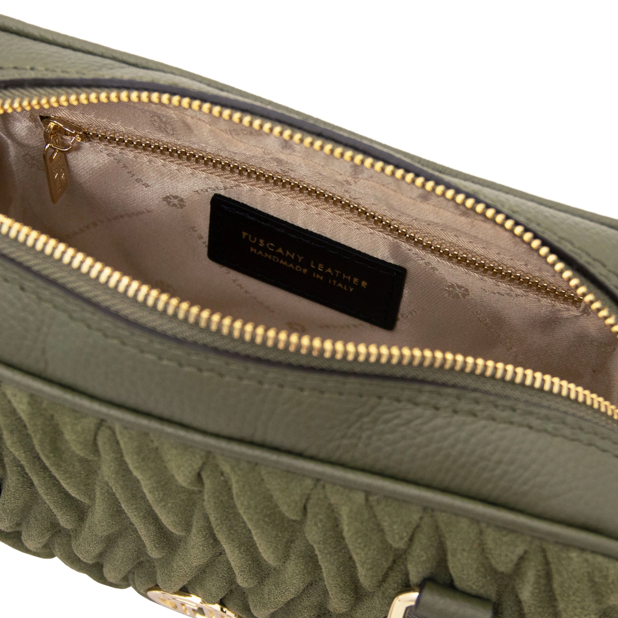 Interior view of Chantilly Suede Handbag in green with beige lining and zip pocket