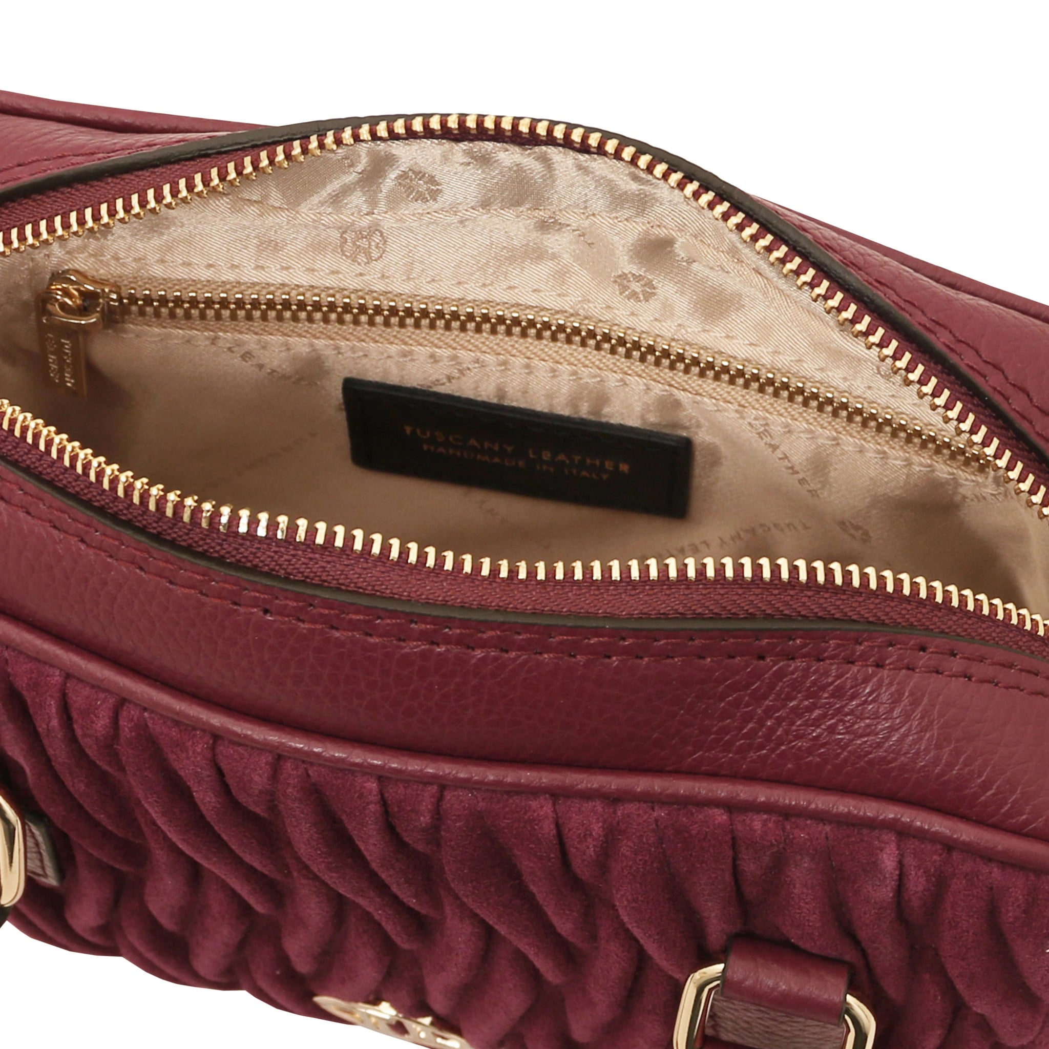 Interior view of Chantilly Suede Handbag in bordeaux with beige lining and zip pocket