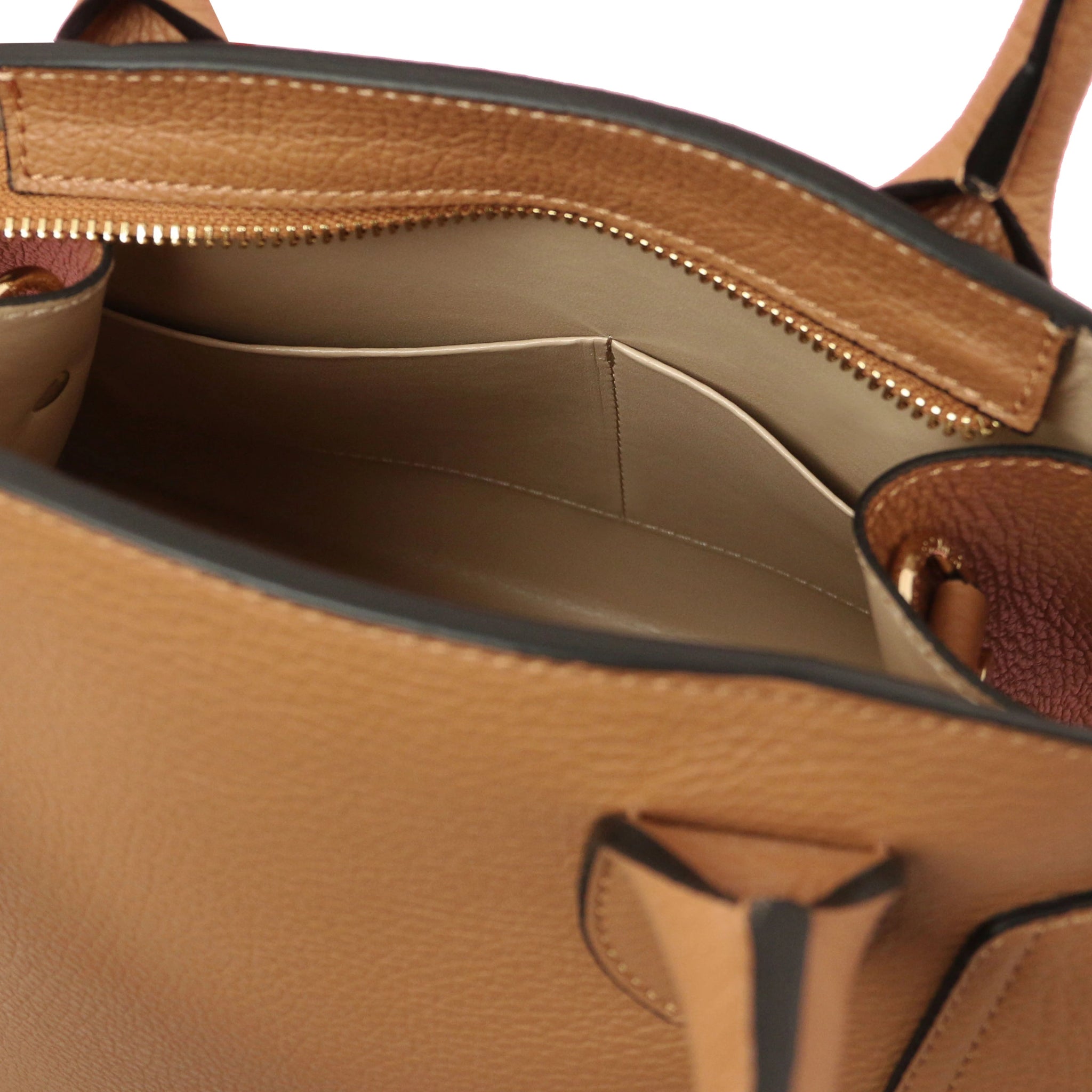 Interior open Pocket View Coccola Italian Pebbled Leather Handbag in Caramel with beige lining