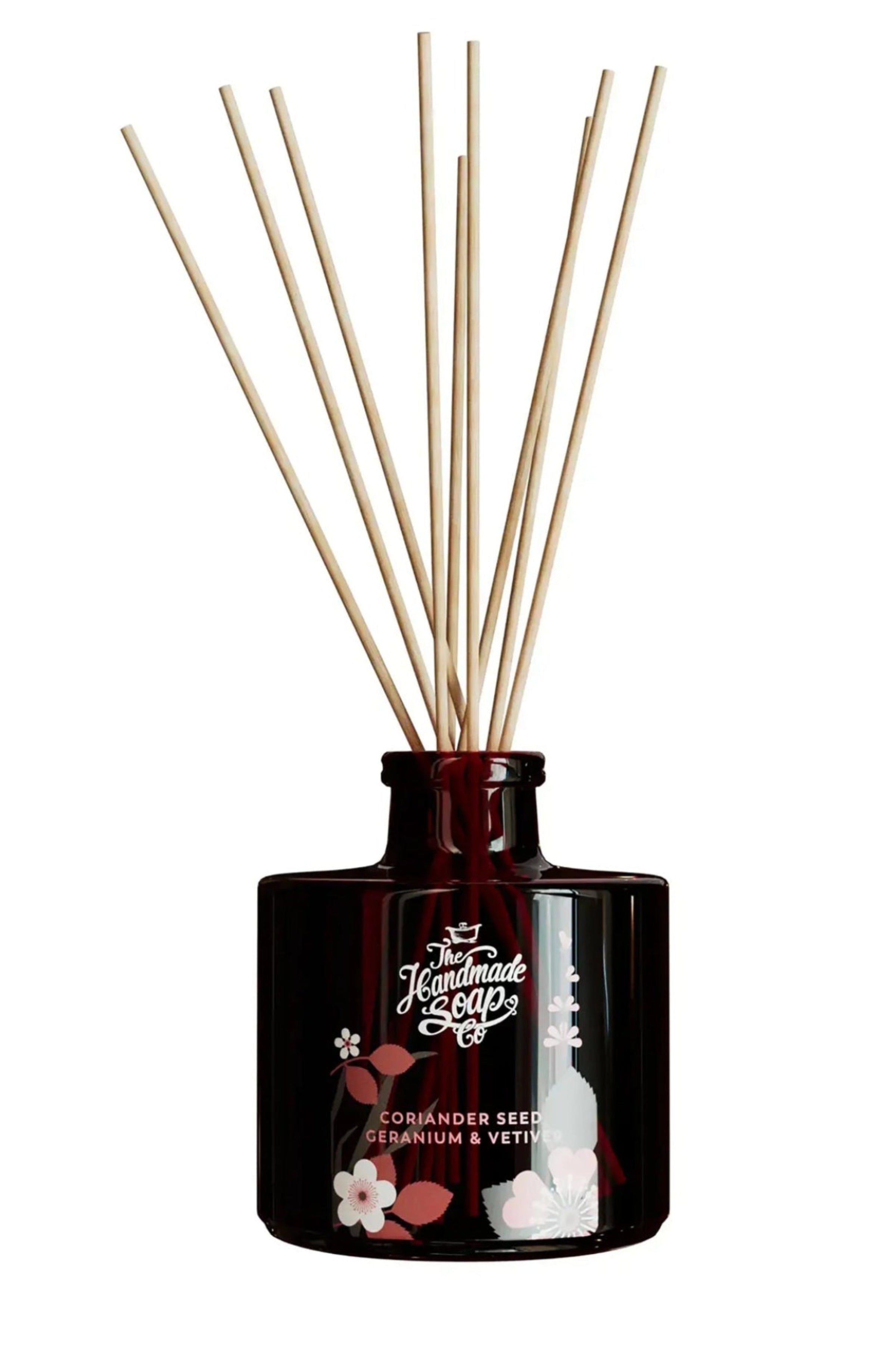 Dark Brown diffuser bottle with wooden sticks on a white background