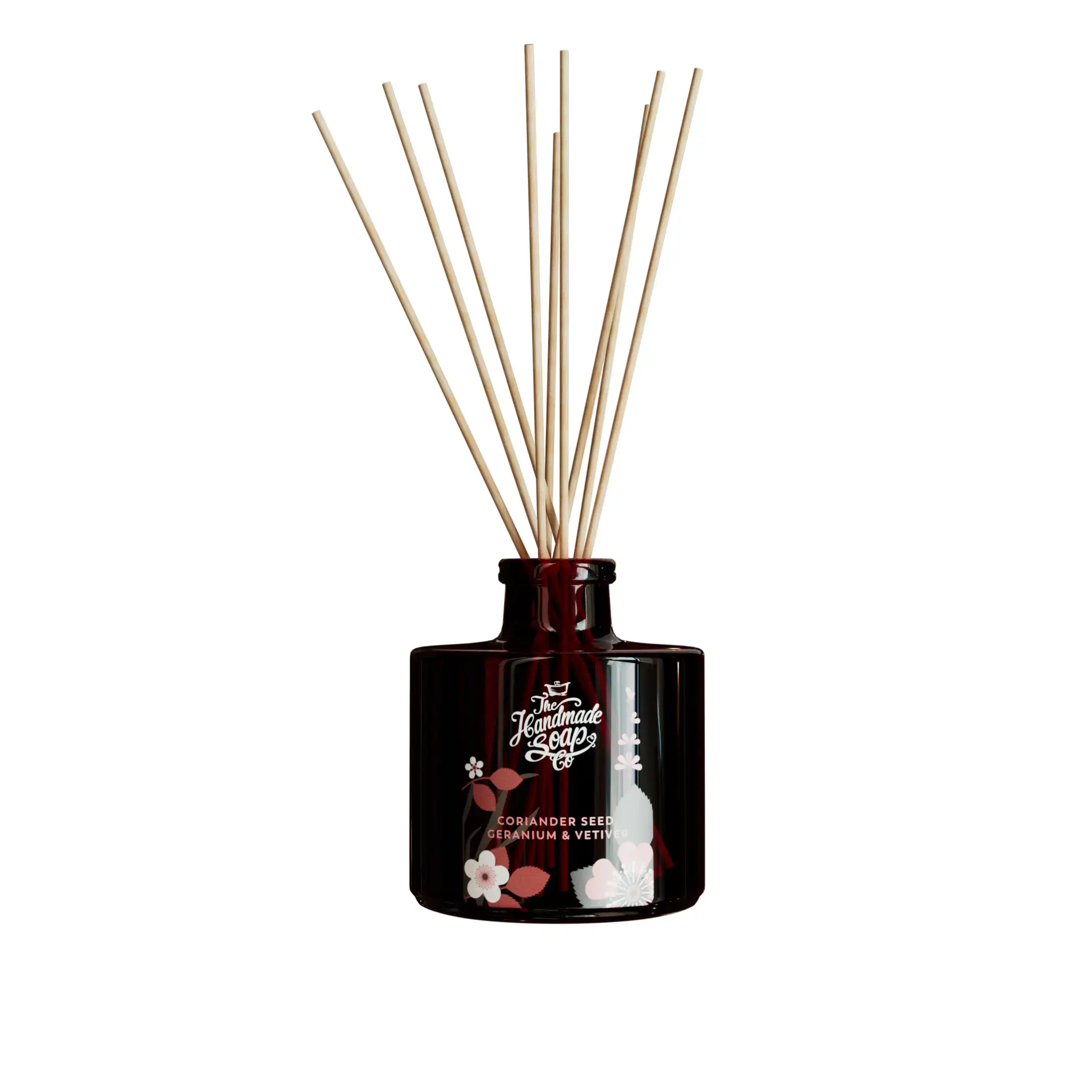 Reed diffuser with wooden sticks in a dark brown bottle on a white background