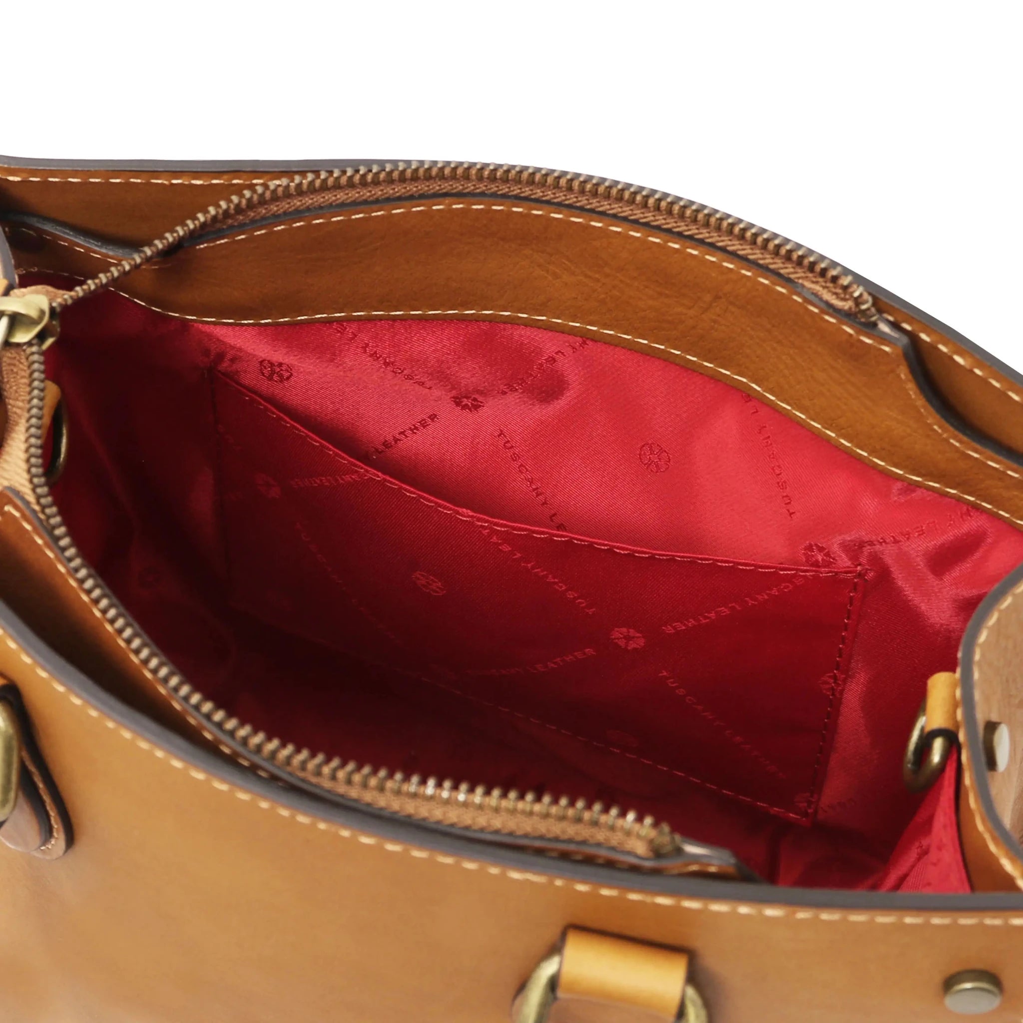 Interior open pocket red lining view Dama Leather Handbag in natural