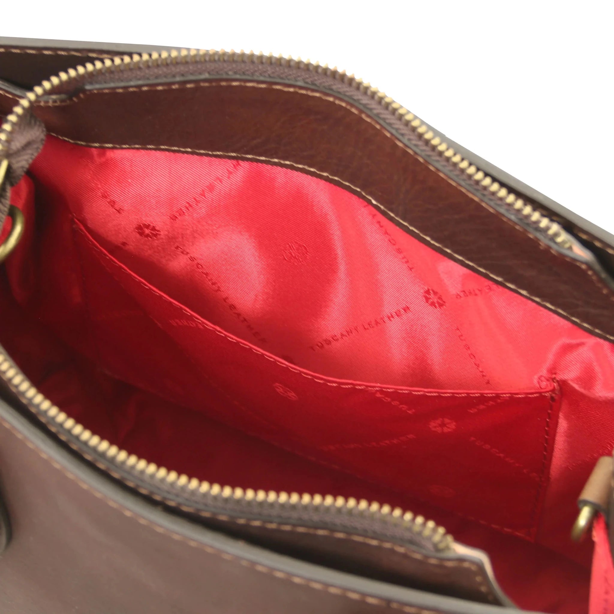 Interior open pocket red lining view Dama Leather Handbag in dark brown