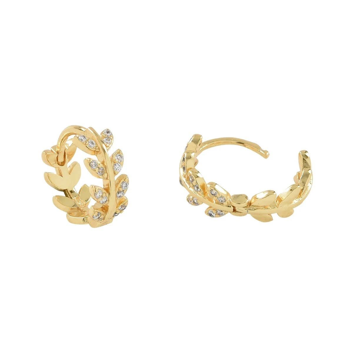 Close up image of the Dancing Leaves Cubic Zirconia Huggie Hoop Gold Earrings on a white background and showing the CZ's sparkle