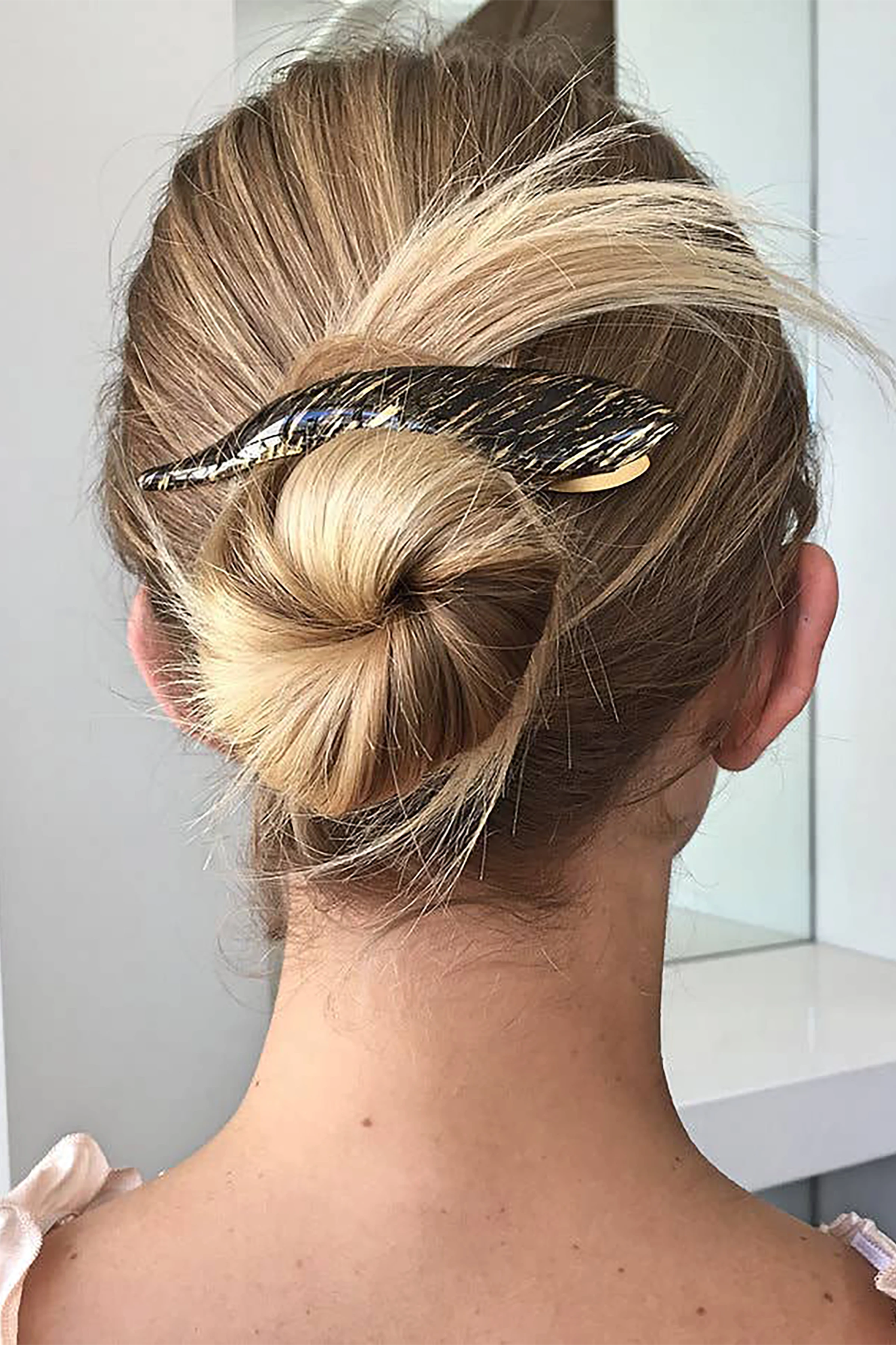 Dark Blonde Enamel Hair Clip on a woman's blonde french twist